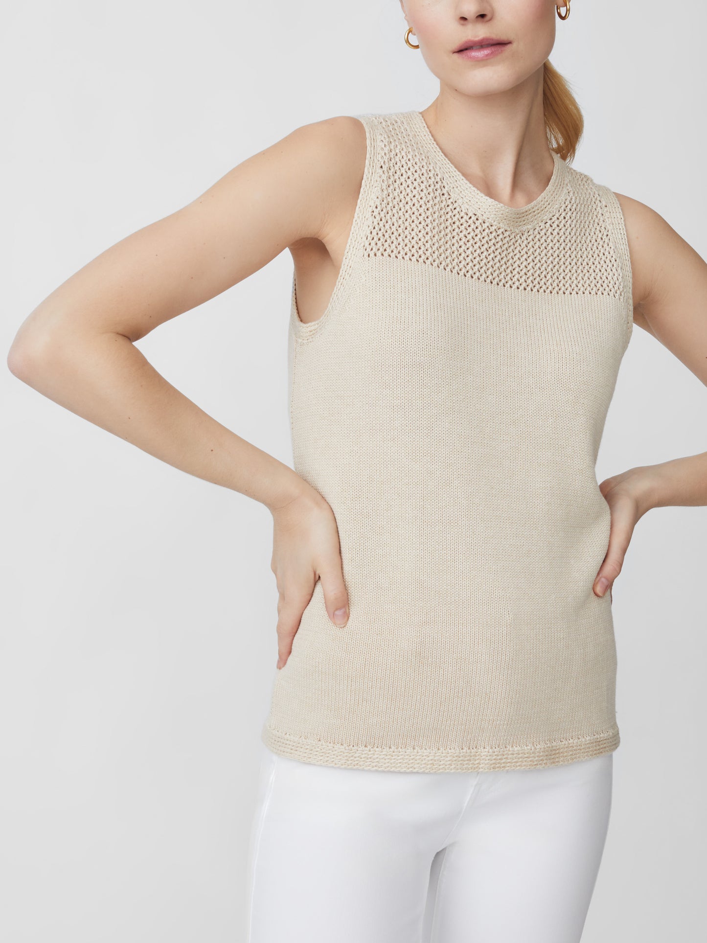 J.McLaughlin model wears Fripp Sleeveless Sweater in Heather Oatmeal made with Cotton and Modal.