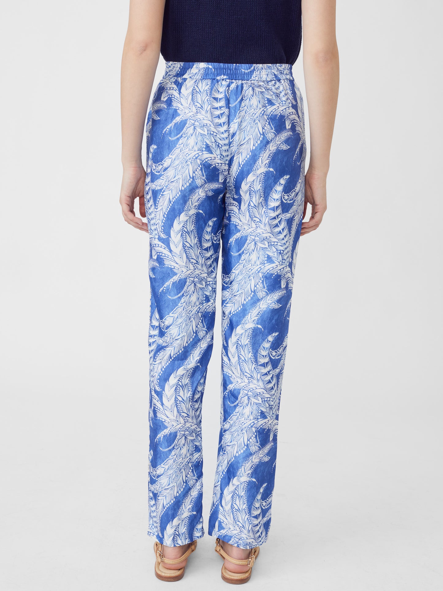 J.McLaughlin model wears Giada Silk Pants in Fernflower in Dark Blue/Blue made with Silk and Viscose.