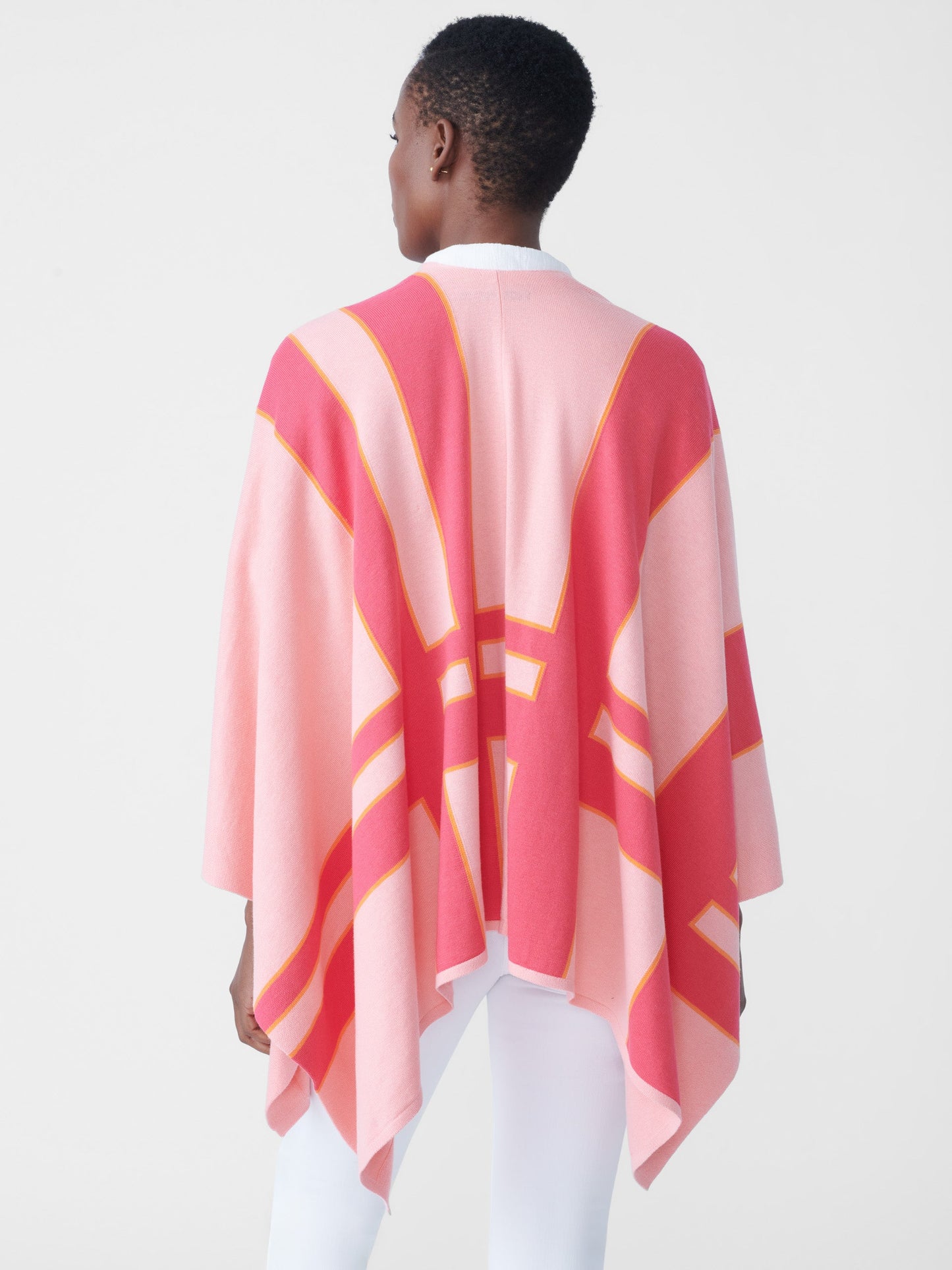 Model wearing J.McLaughlin Giuletta wrap in pale rose/coral made with cotton/modal.