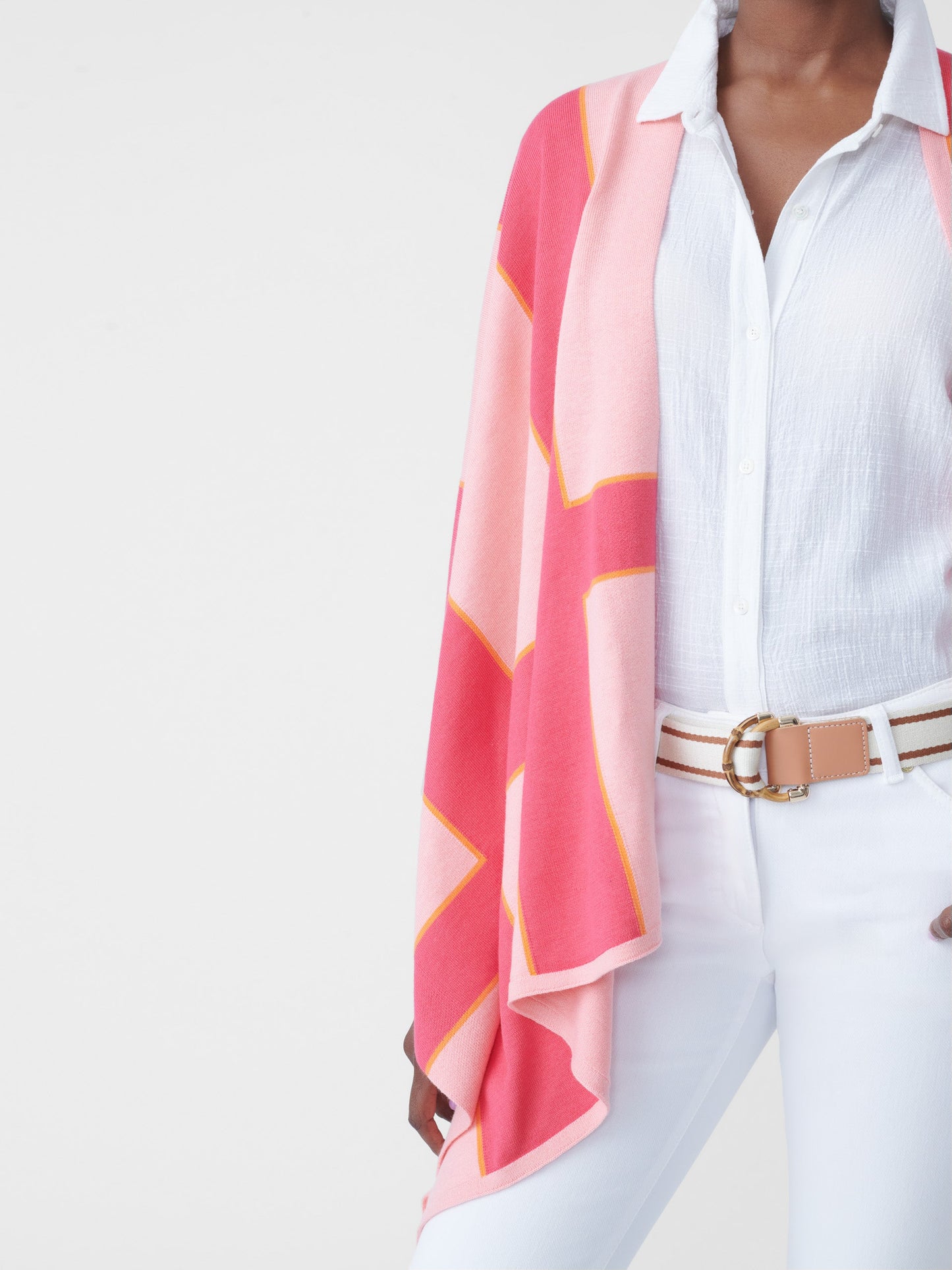 Model wearing J.McLaughlin Giuletta wrap in pale rose/coral made with cotton/modal.
