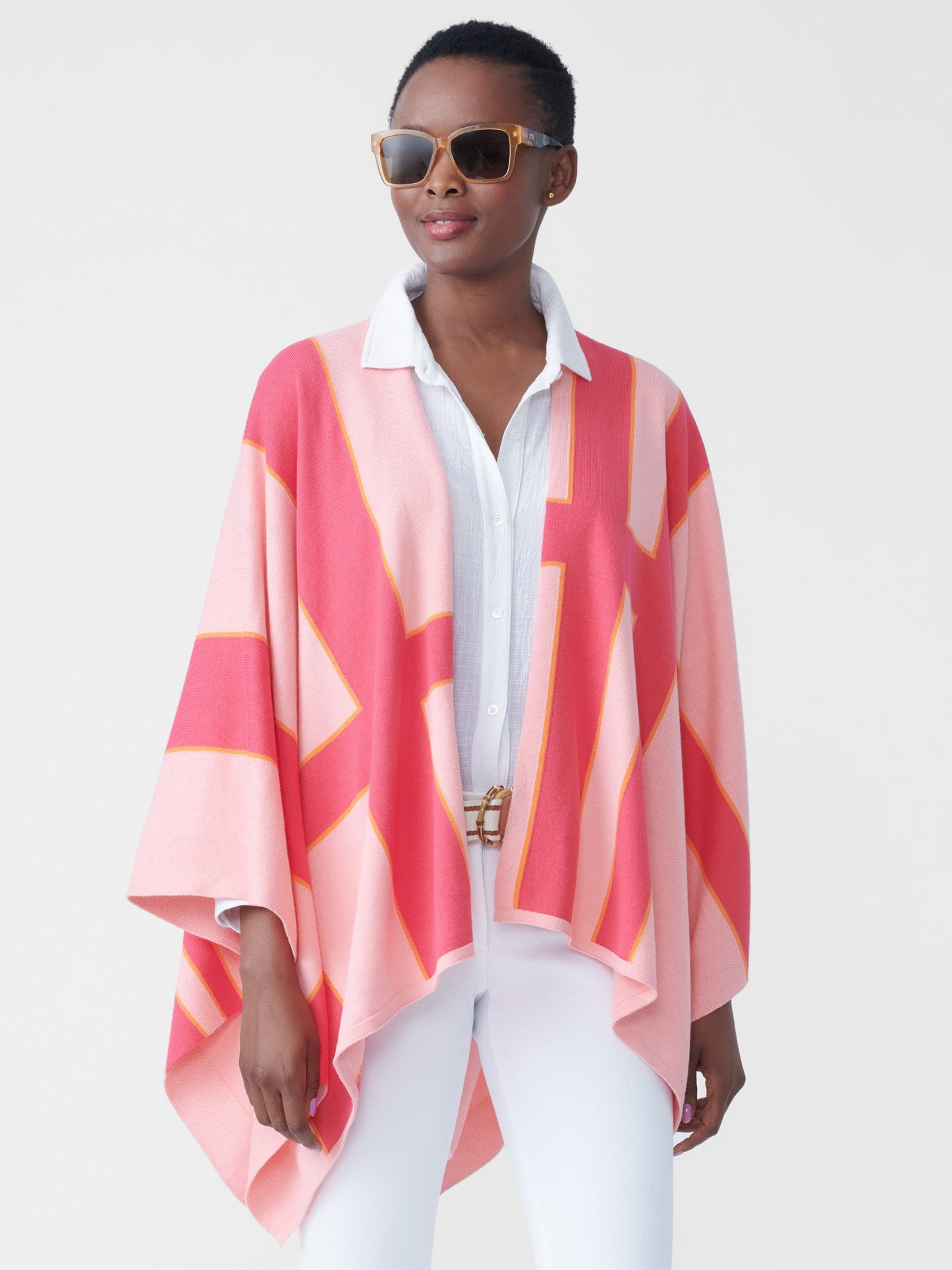 Model wearing J.McLaughlin Giuletta wrap in pale rose/coral made with cotton/modal.