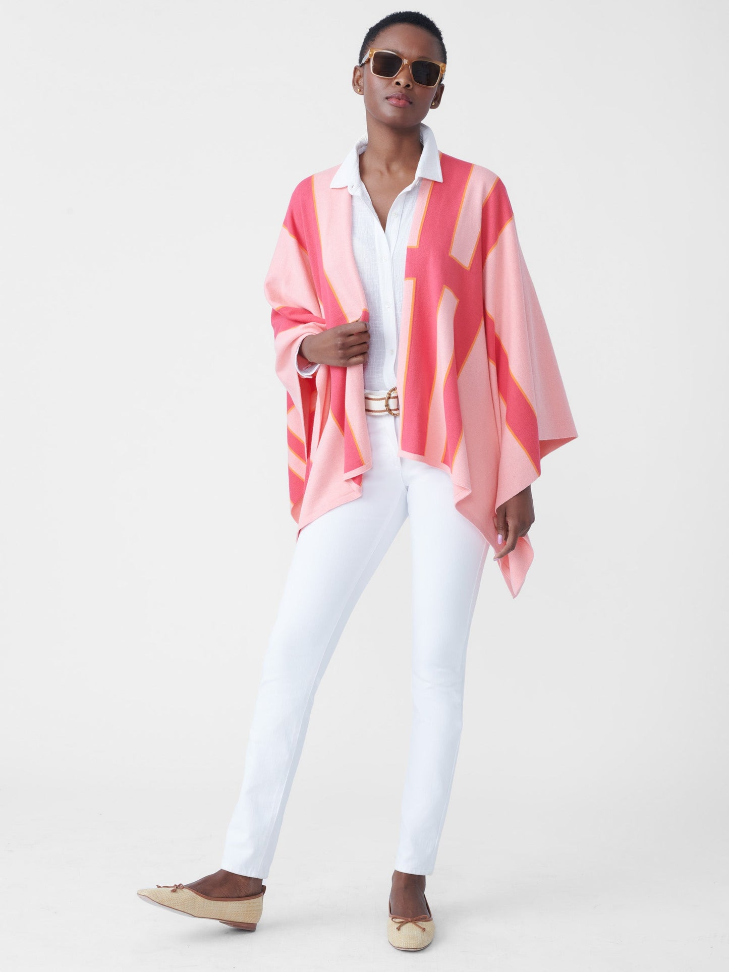 Model wearing J.McLaughlin Giuletta wrap in pale rose/coral made with cotton/modal.