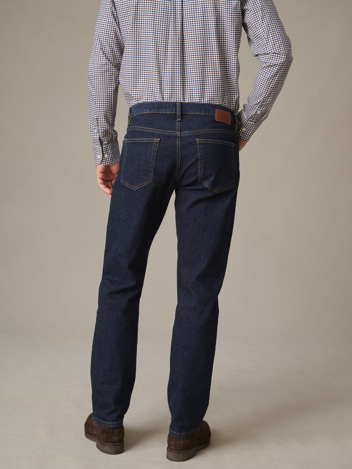 Mercer Jeans by J.McLaughlin shown from behind on a model in dark stretch denim with a five pocket design and a clean refined fit