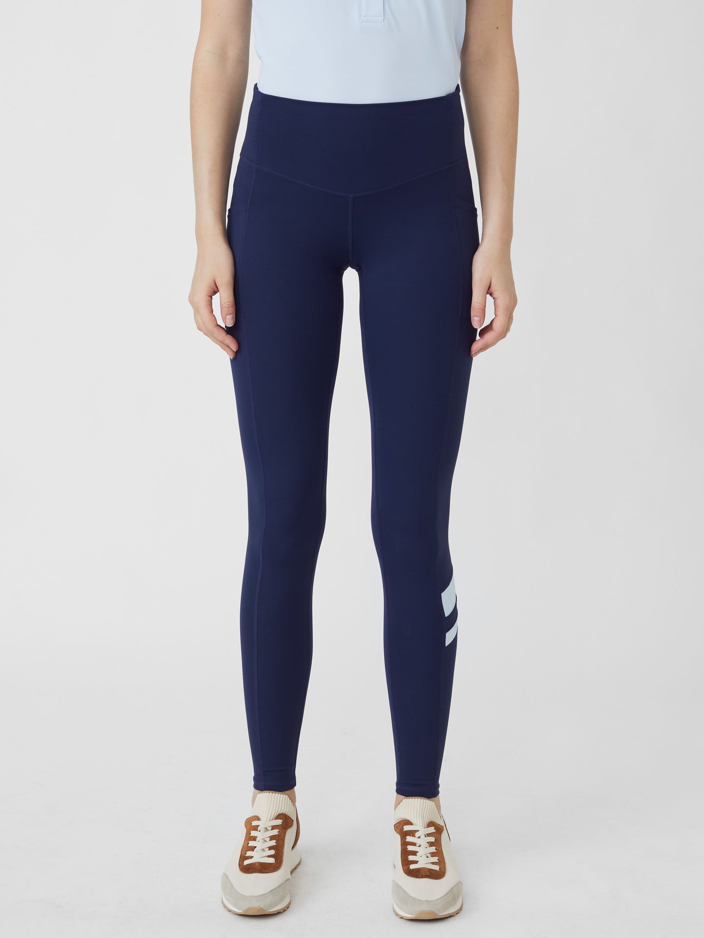 J.McLaughlin model wears Rae Leggings in Navy made with Nylon and Spandex.