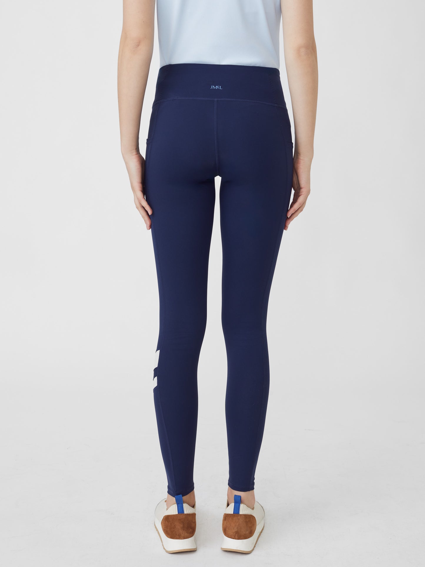 J.McLaughlin model wears Rae Leggings in Navy made with Nylon and Spandex.