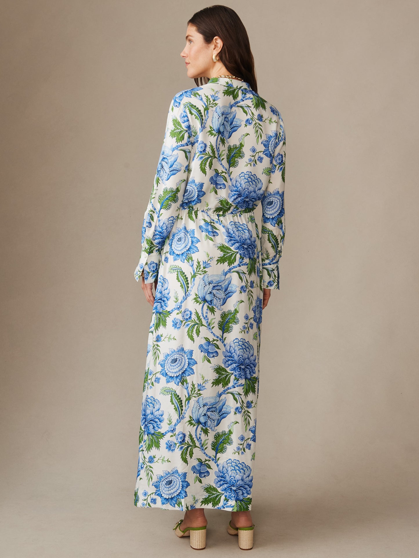 Woman wearing Hannah Silk Blend Dress in Cerulean Garden by J.McLaughlin, featuring an enduring floral design in blue and green hues, showcasing effortless style and timeless elegance.