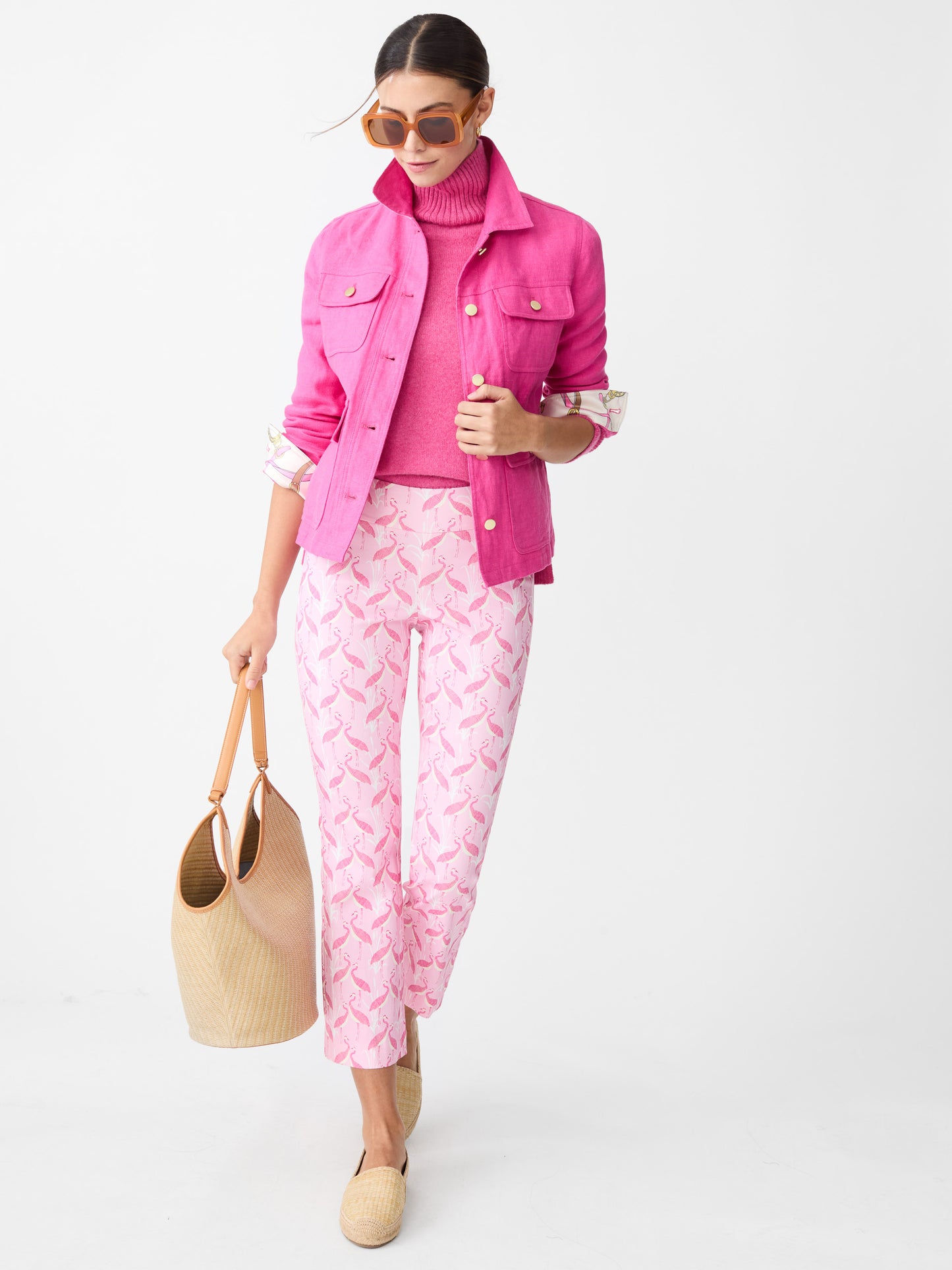 Model wearing J.McLaughlin Ivy pants in pink/light pink made with Amelia cloth.