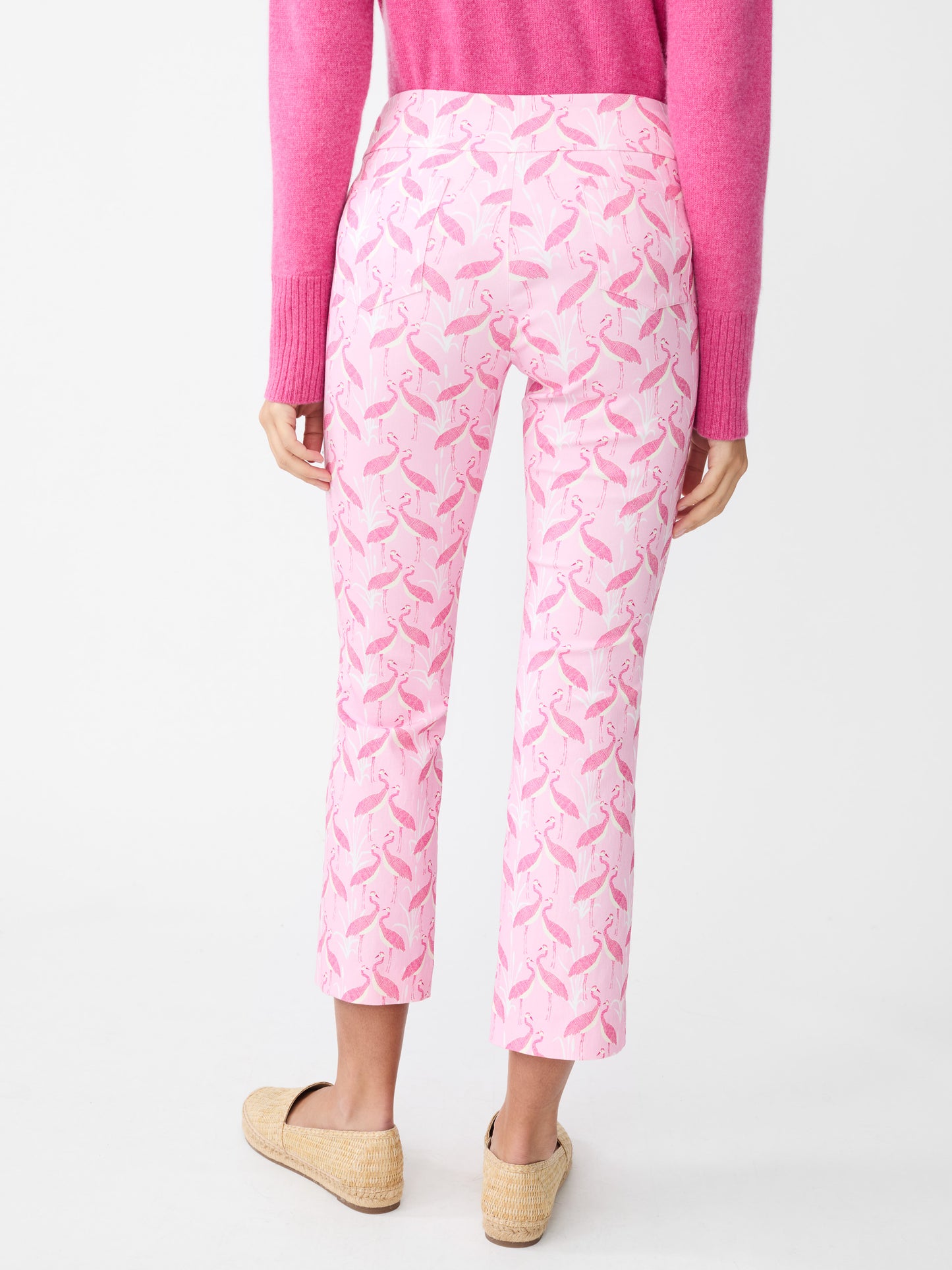 Model wearing J.McLaughlin Ivy pants in pink/light pink made with Amelia cloth.