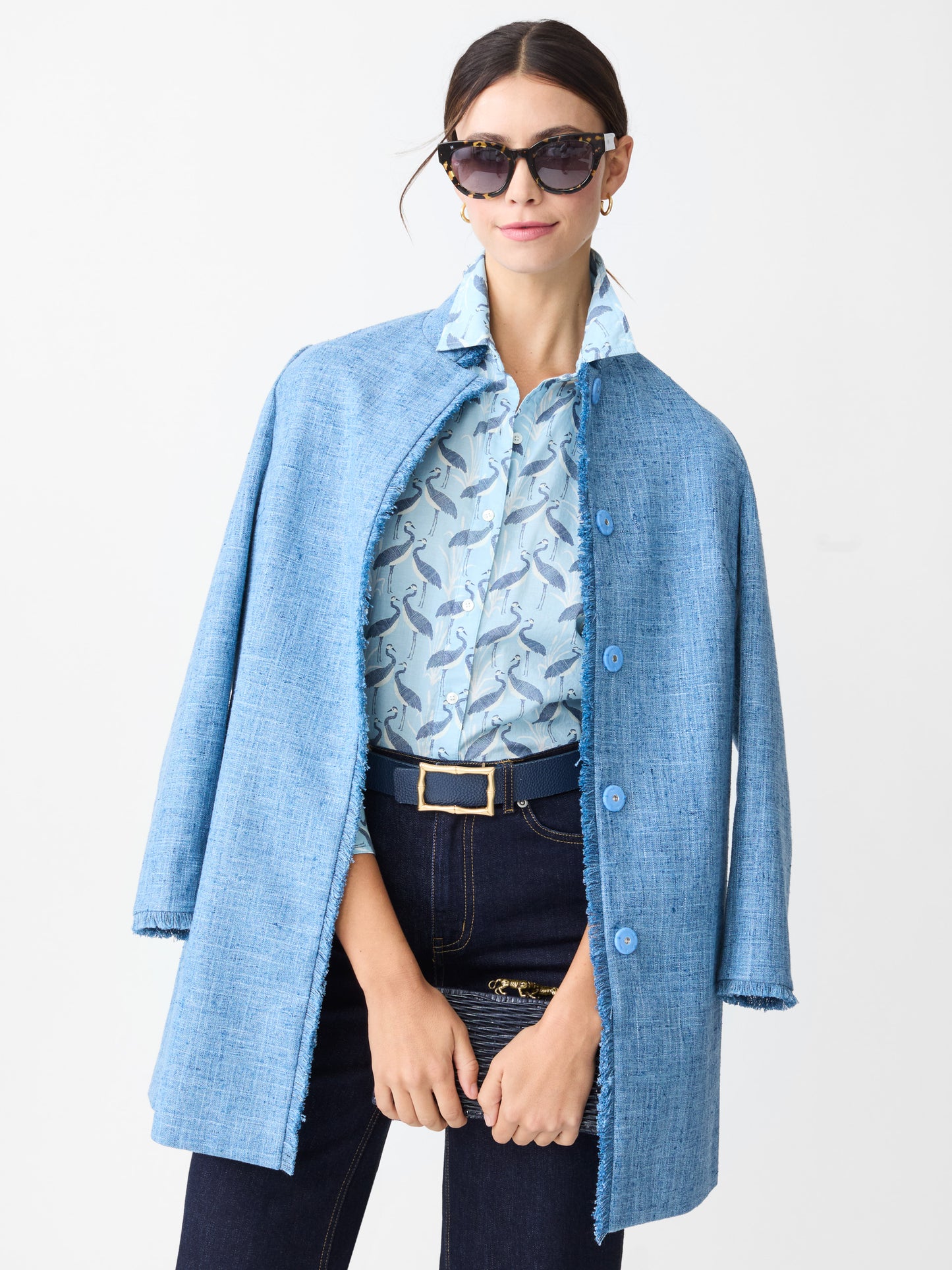 Model wearing J.McLaughlin Lois shirt in light blue/navy made with cotton.