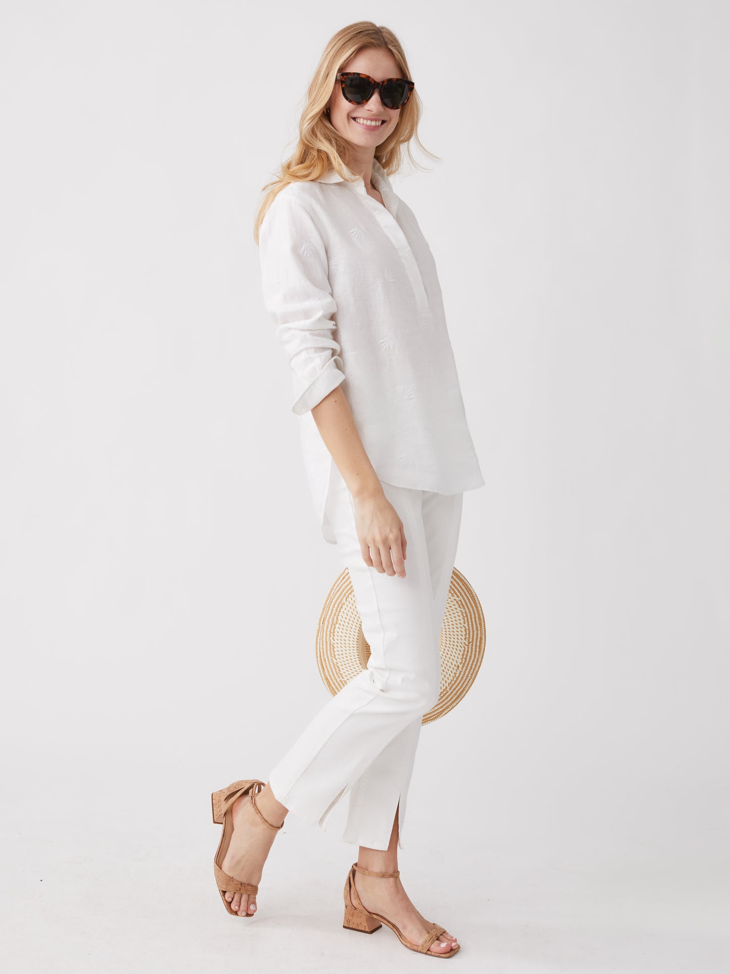 Model wearing J.McLaughlin Lula shirt in white made with linen.