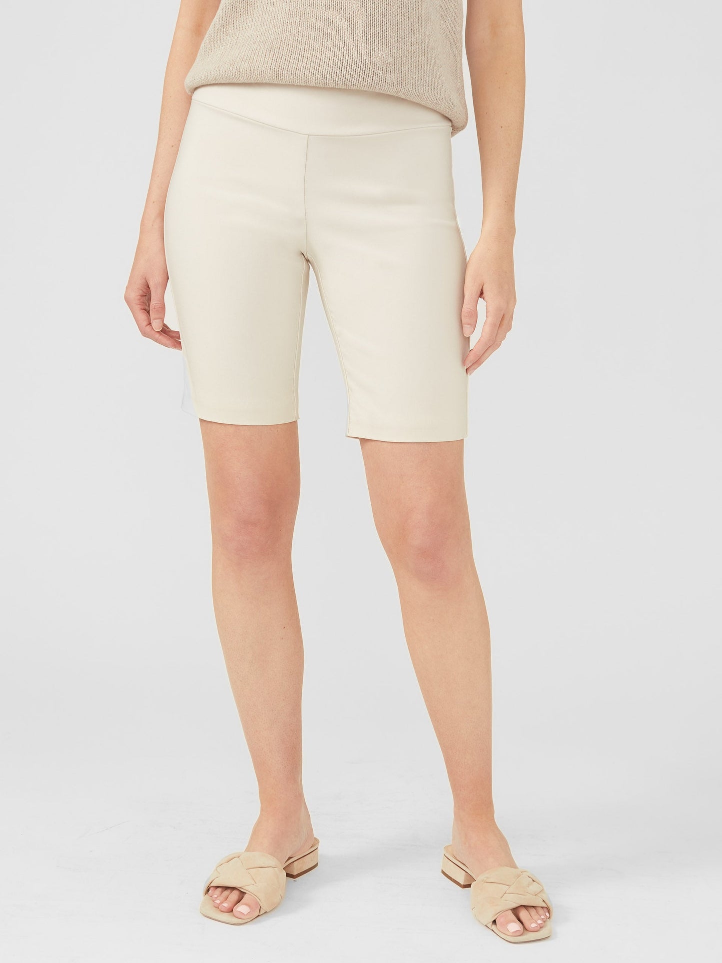 Model wearing J.McLaughlin Masie shorts in stone made with Amelia cloth.