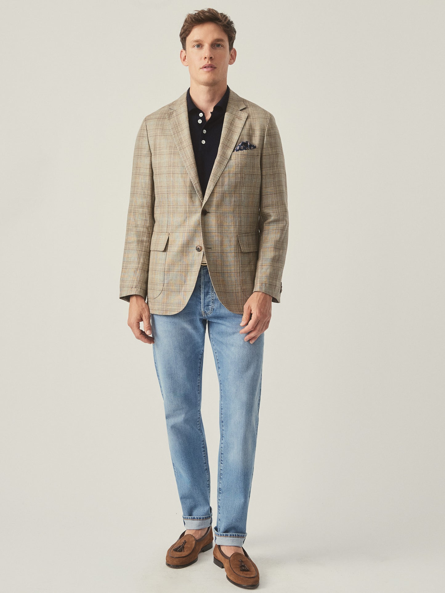 Model wearing J.McLaughlin McCown blazer in tan/brown/blue made with wool and linen.
