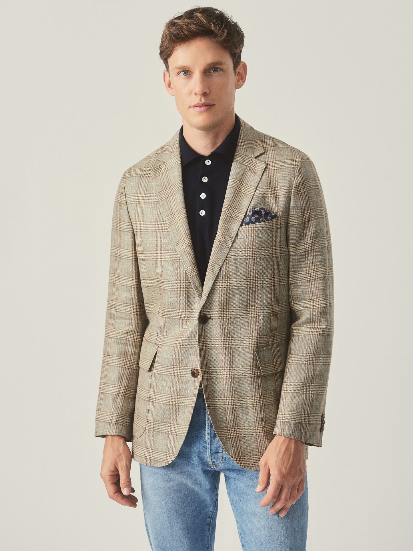 Model wearing J.McLaughlin McCown blazer in tan/brown/blue made with wool and linen.