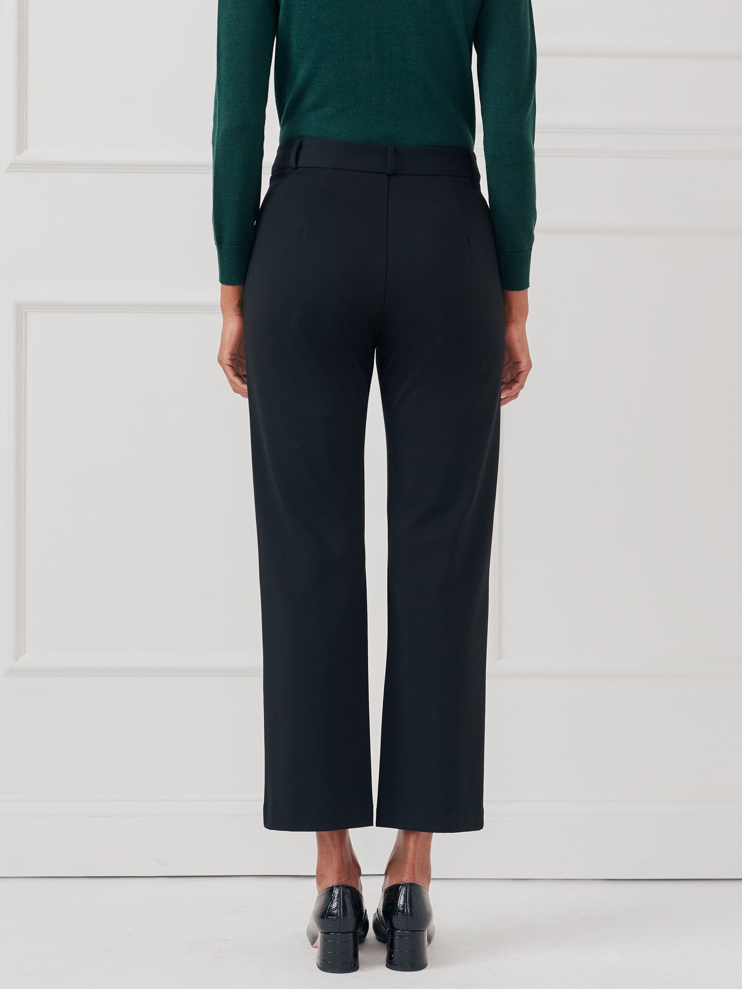 Model wearing J.McLaughlin Deanne pants in black made with Bainbridge fabric.
