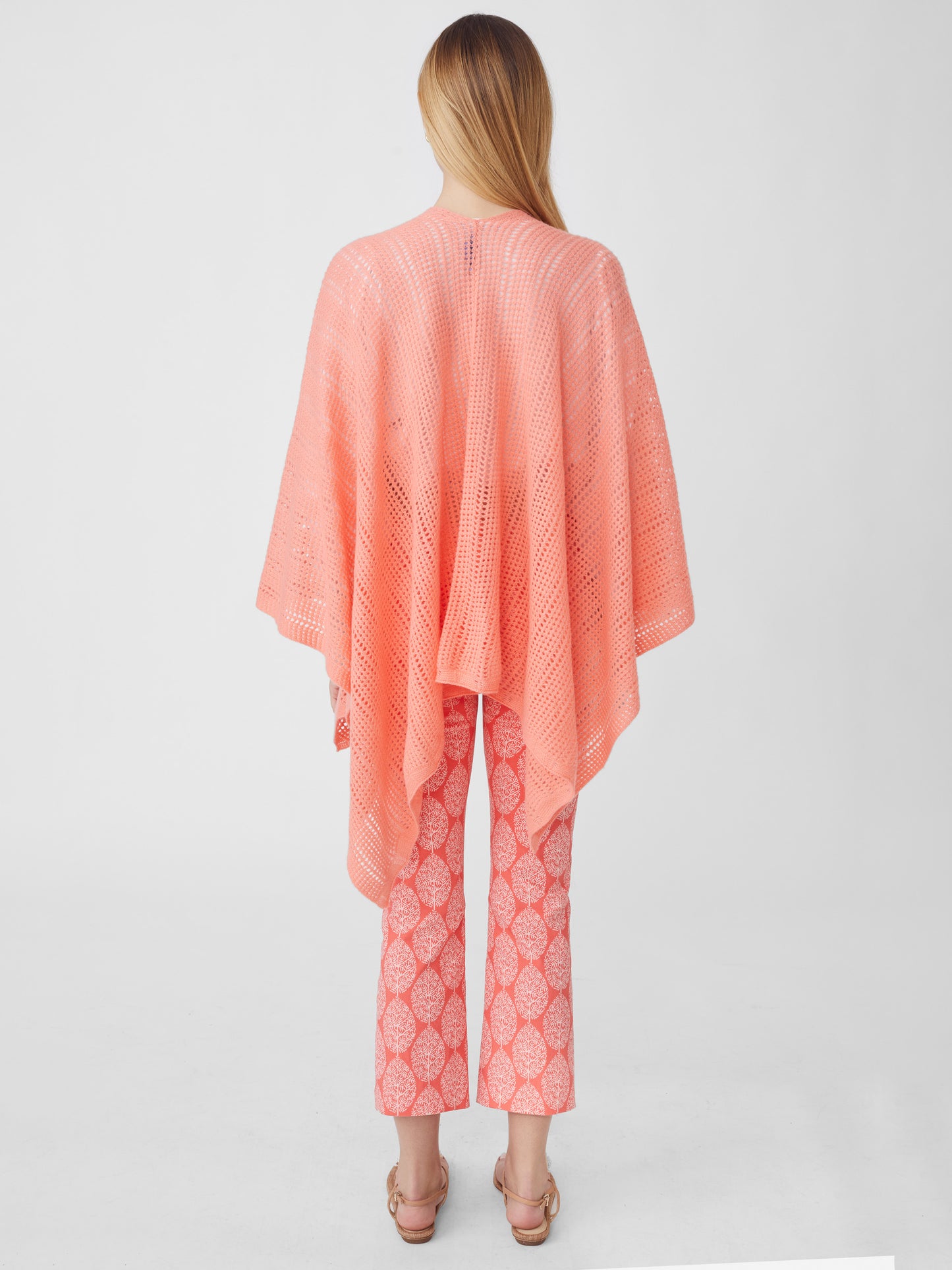 J.McLaughlin model wears Paola Cashmere Wrap in Papaya made with Cashmere.