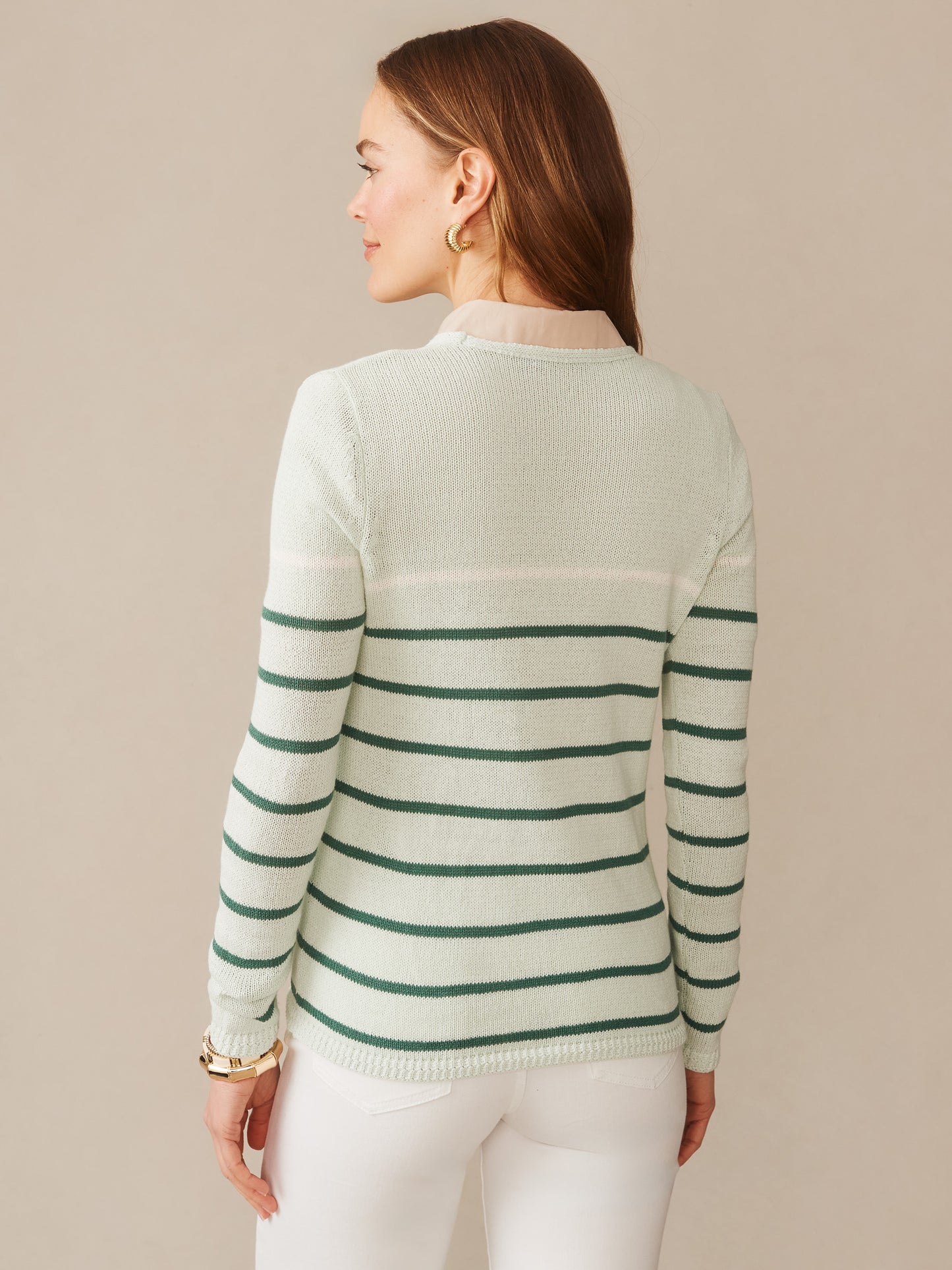 Woman wearing Ramona Linen Blend Sweater in Stripe by J.McLaughlin, featuring effortlessly stylish green stripes and innovative fabrics for enduring designs, a destination for defining style. Life, Well-Lived.