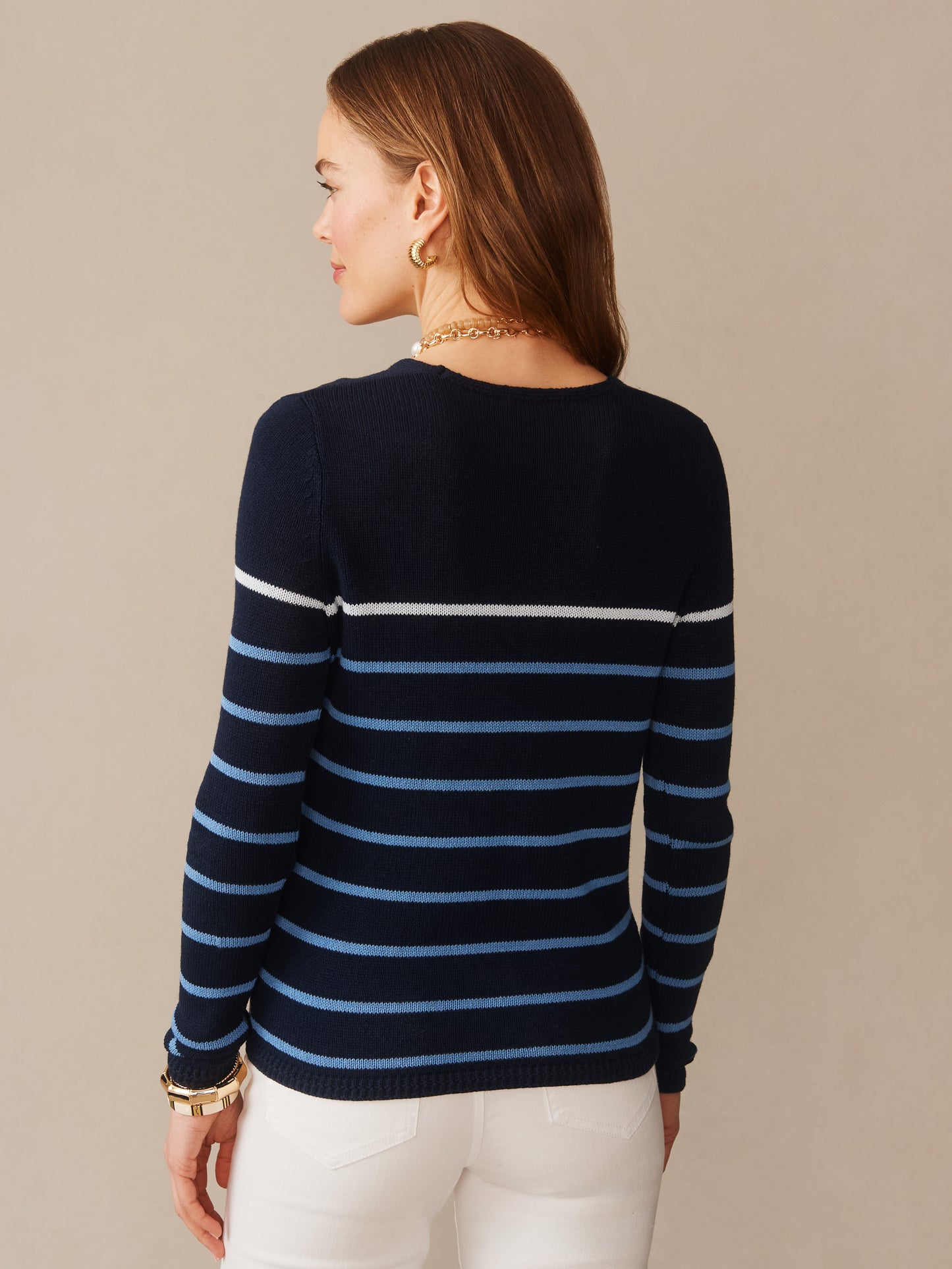 Woman wearing a navy and blue striped Ramona Linen Blend Sweater in Stripe by J.McLaughlin, showcasing effortlessly stylish, enduring designs with innovative fabrics and a legacy of timeless fashion. A destination for defining style. Life, Well-Lived.