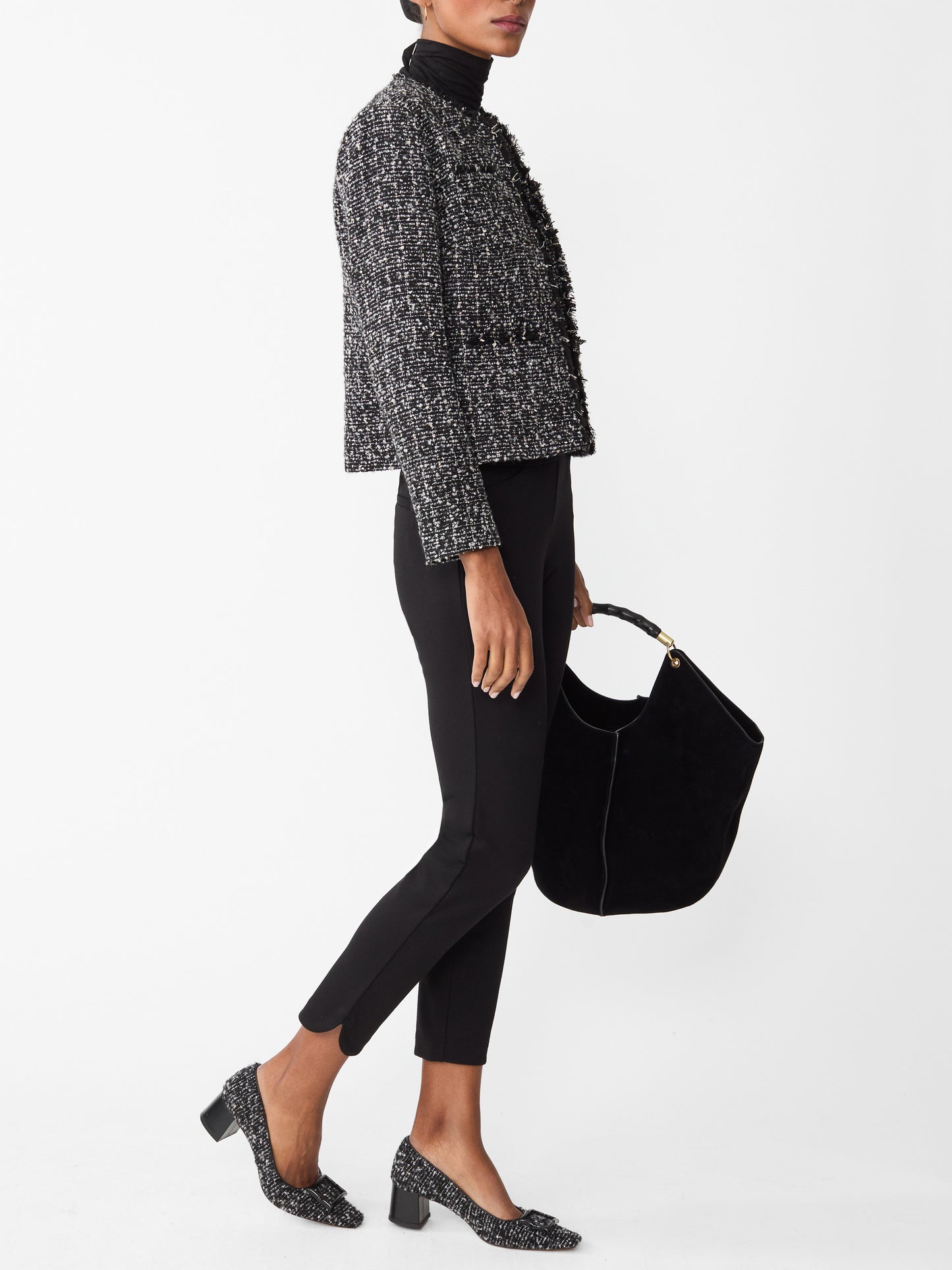 Model wearing J.McLaughlin Romilly pants in black made with Bainbridge fabric.