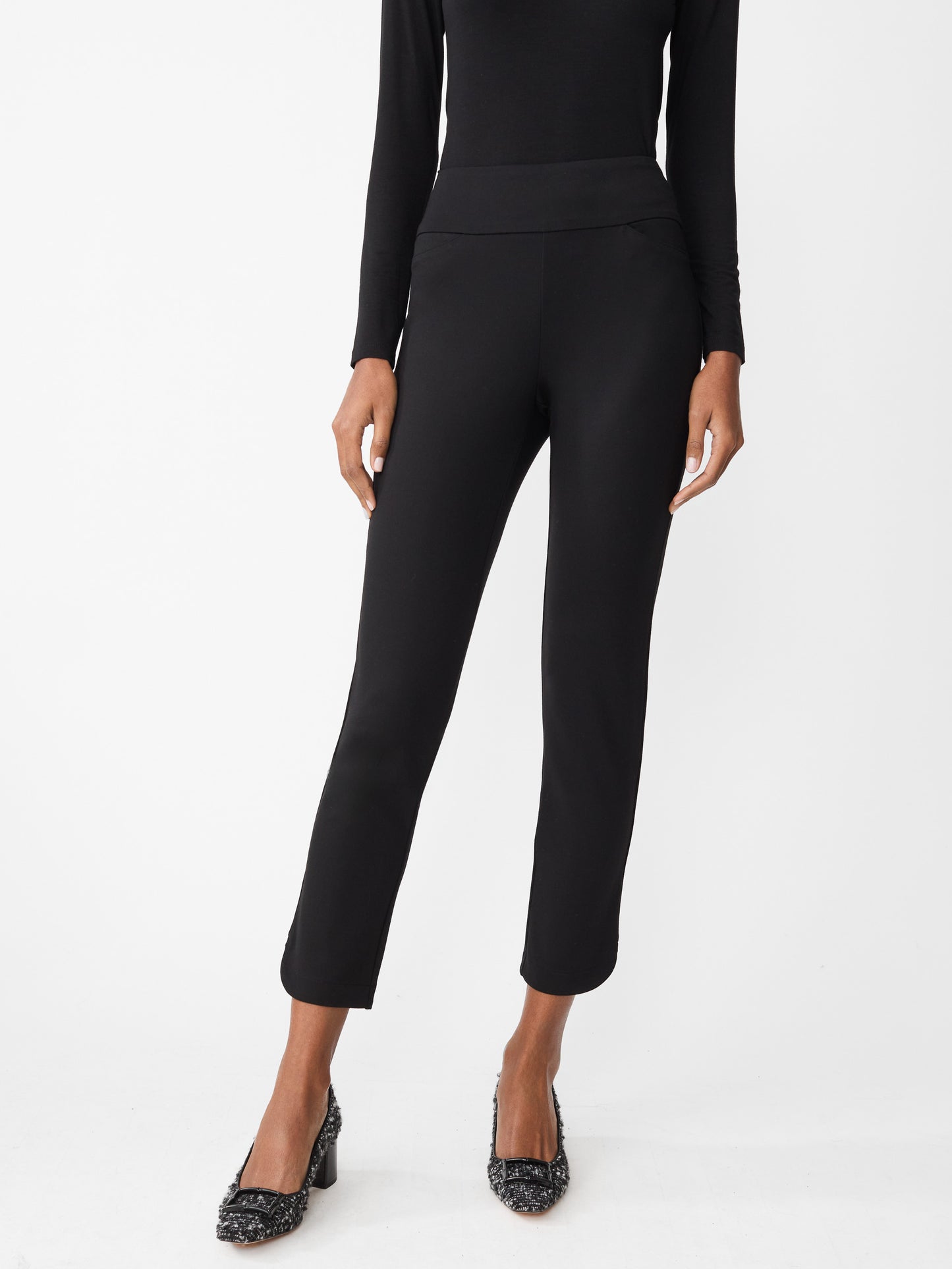 Model wearing J.McLaughlin Romilly pants in black made with Bainbridge fabric.