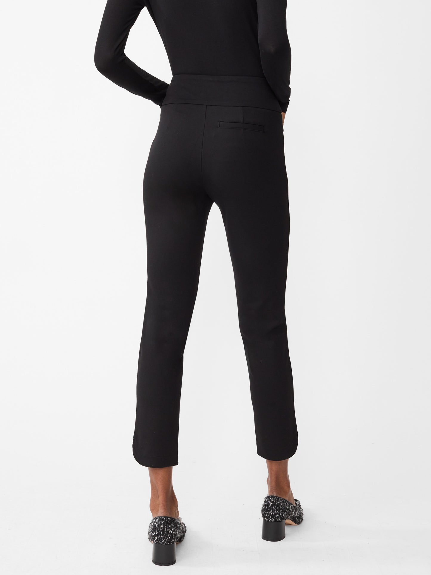 Model wearing J.McLaughlin Romilly pants in black made with Bainbridge fabric.
