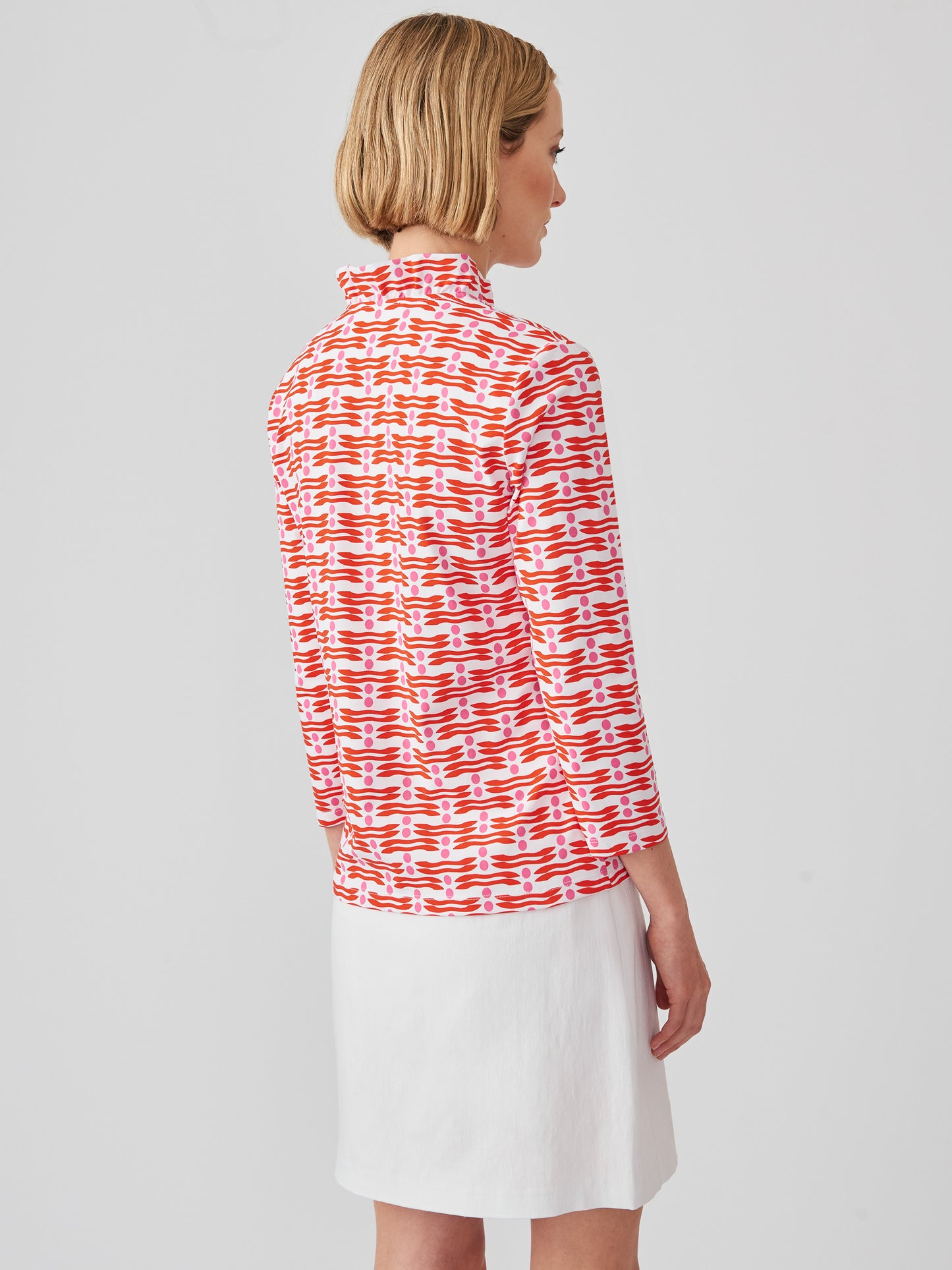 J.McLaughlin Sahara ruffle top in white/red/pink made with Catalina cloth.