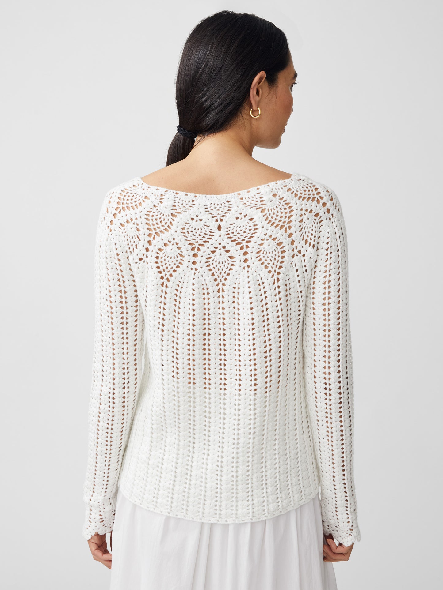 J.McLaughlin model wears Shellona Crochet Sweater in white made with cotton.