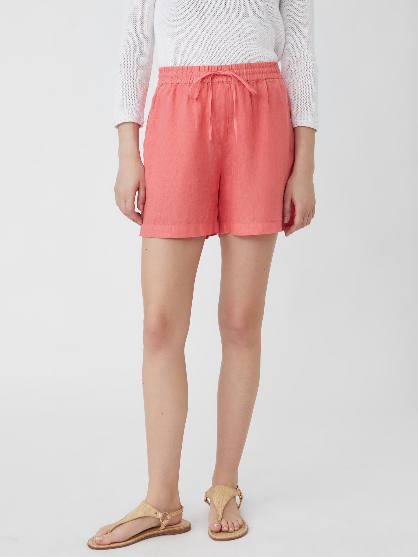 J.McLaughlin model wears Surya Linen Shorts in Apricot made with Linen.
