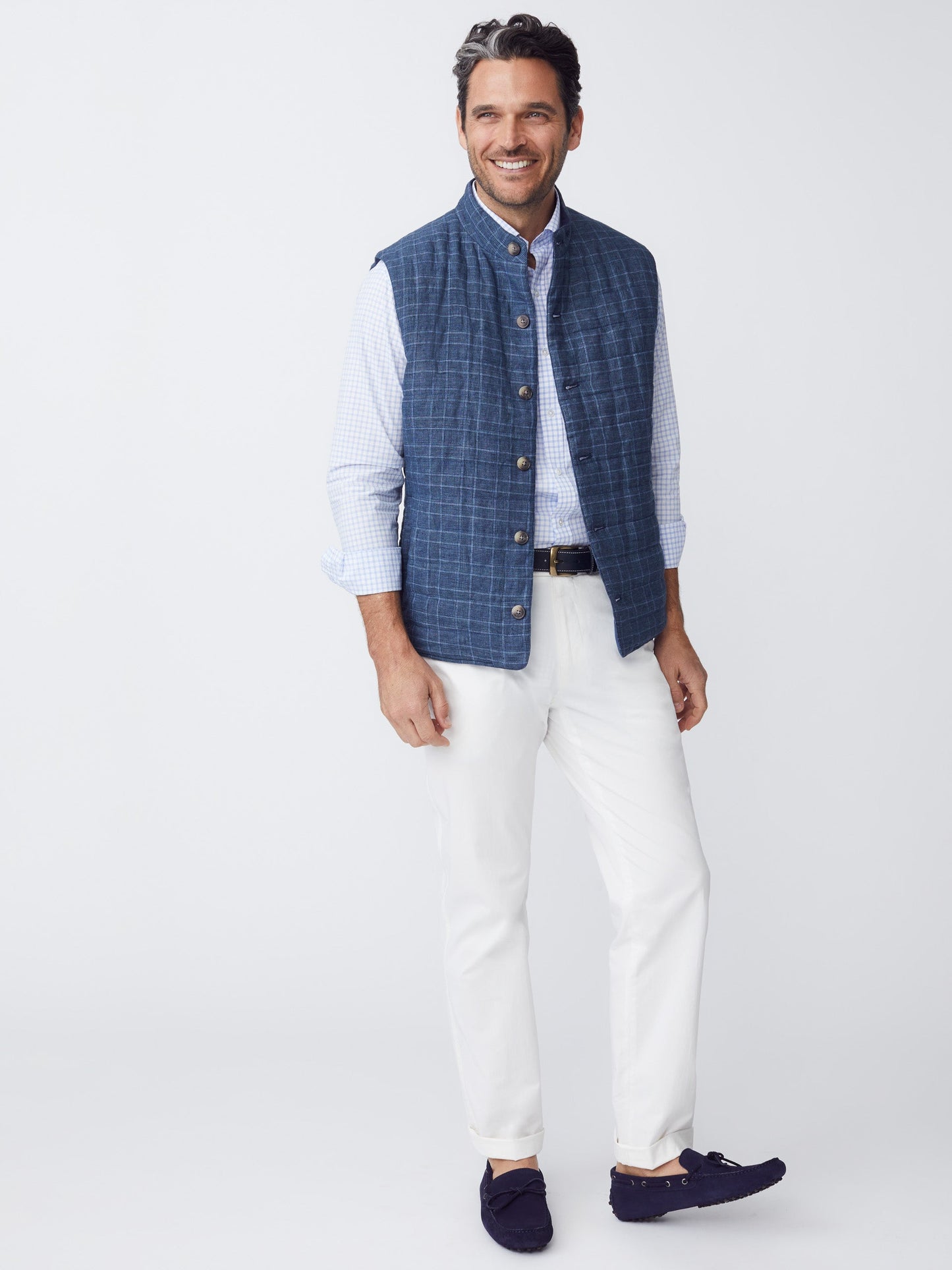 Model wearing J.McLaughlin Taylor pants in white made with cotton/spandex.