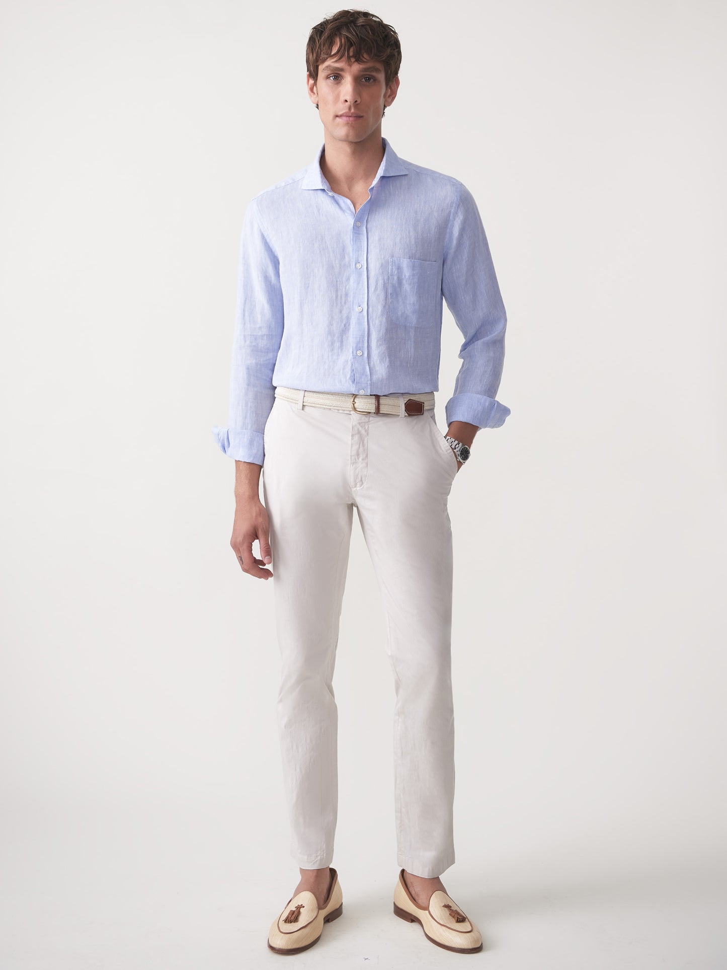 Model wearing J.McLaughlin Taylor pants in stone made with cotton/spandex.