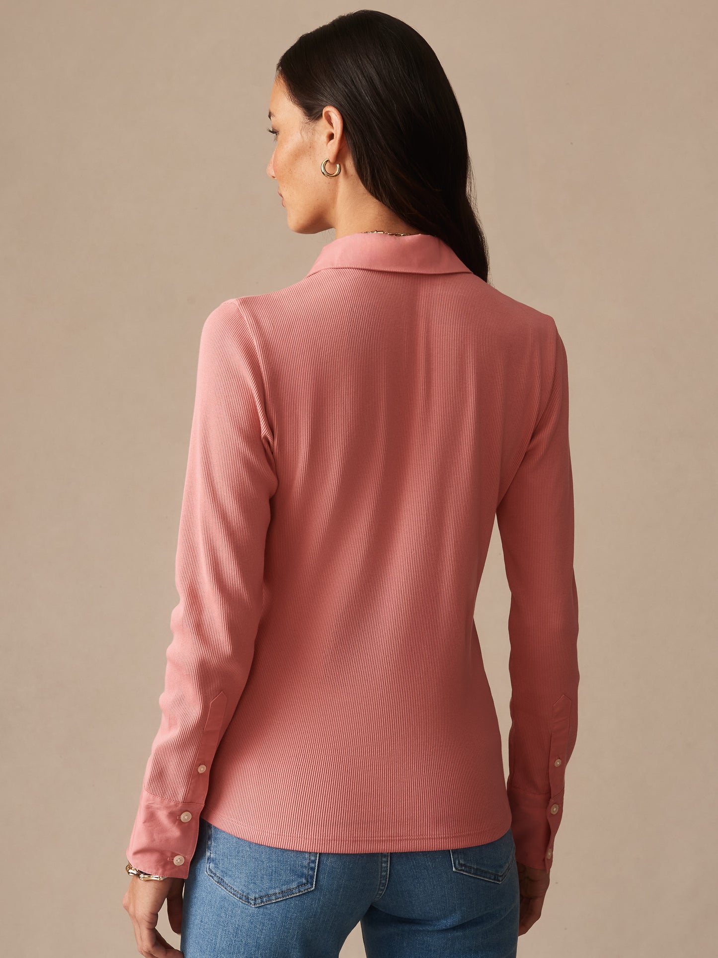 Woman wearing Theodora Shirt in soft mauve pink from J.McLaughlin, showcasing effortlessly stylish design and enduring craftsmanship for a life, well-lived.
