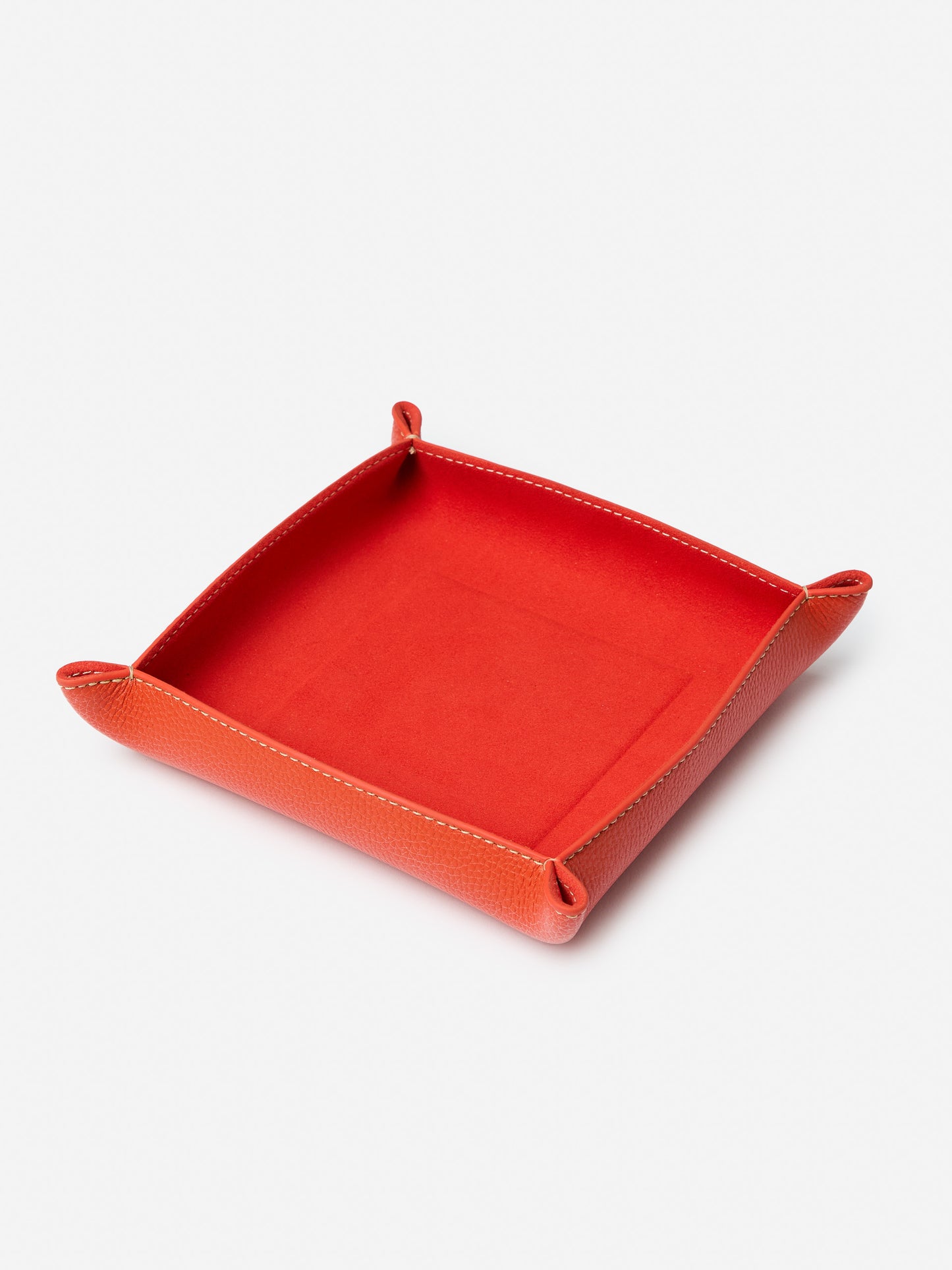 J.McLaughlin Trinket tray in orange made with leather.