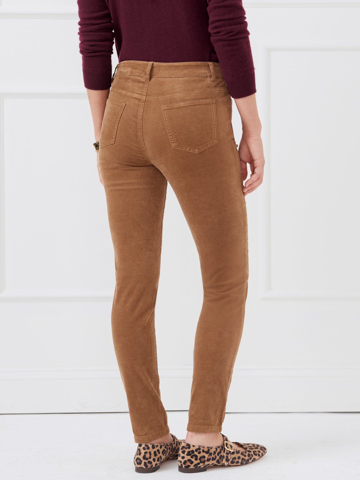 Model wearing J.McLaughlin Watson jeans in camel made with velveteen.