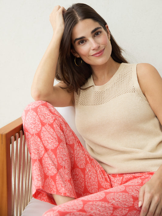 J.McLaughlin model wears Fripp Sleeveless Sweater in Heather Oatmeal made with Cotton and Modal.