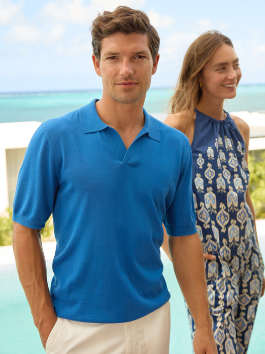 Model wearing J.McLaughlin Cillian sweater polo in blue made with cotton.