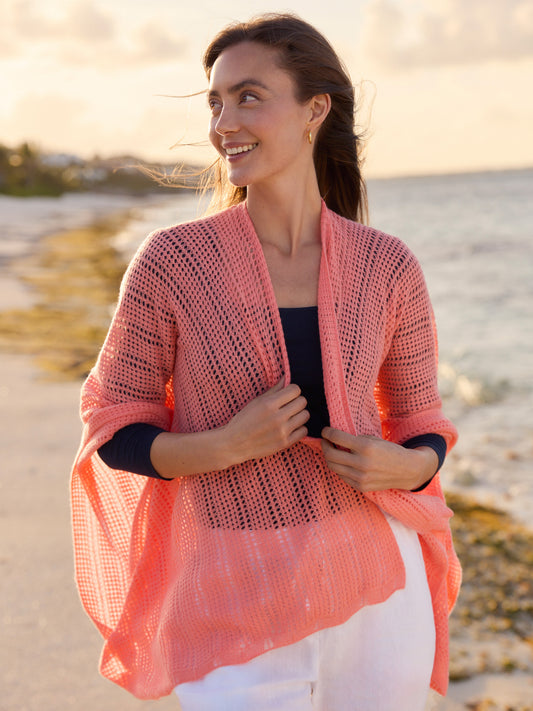 J.McLaughlin model wears Paola Cashmere Wrap in Papaya made with Cashmere.