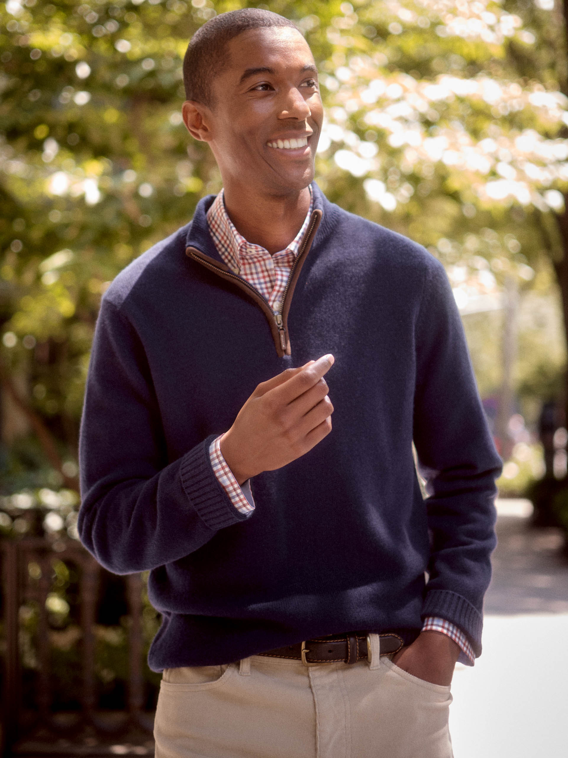 Model wearing J.McLaughlin Tate sweater in classic navy made with cashmere.