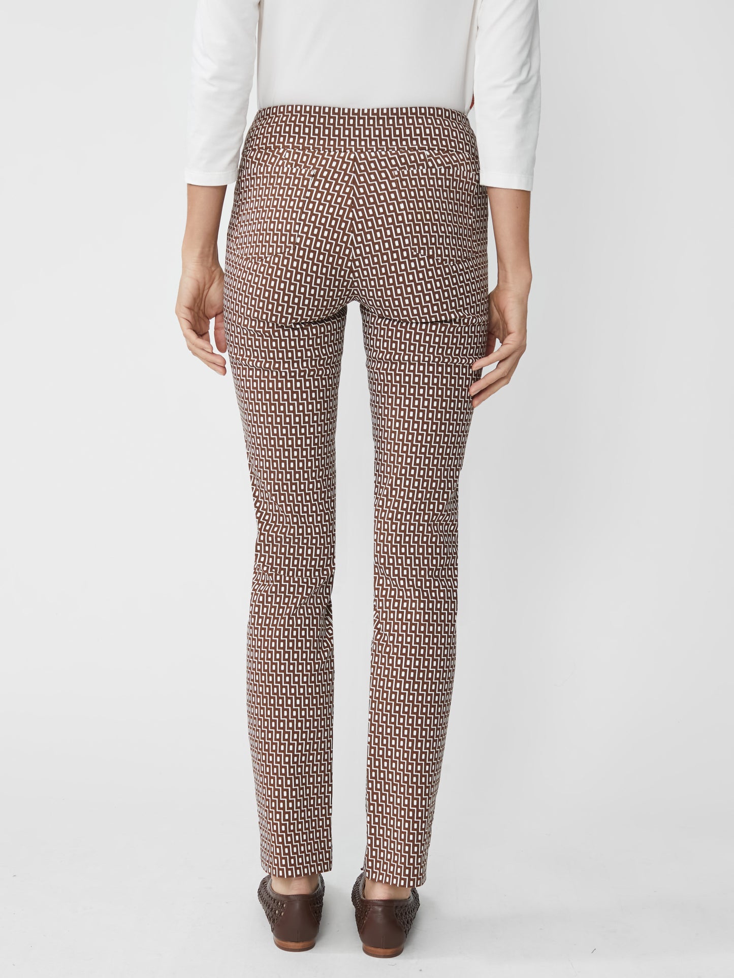 Back view of a woman wearing J.McLaughlin Masie Pants in Micro City Windows featuring an innovative geometric pattern, combining effortlessly stylish design with enduring fabrics.