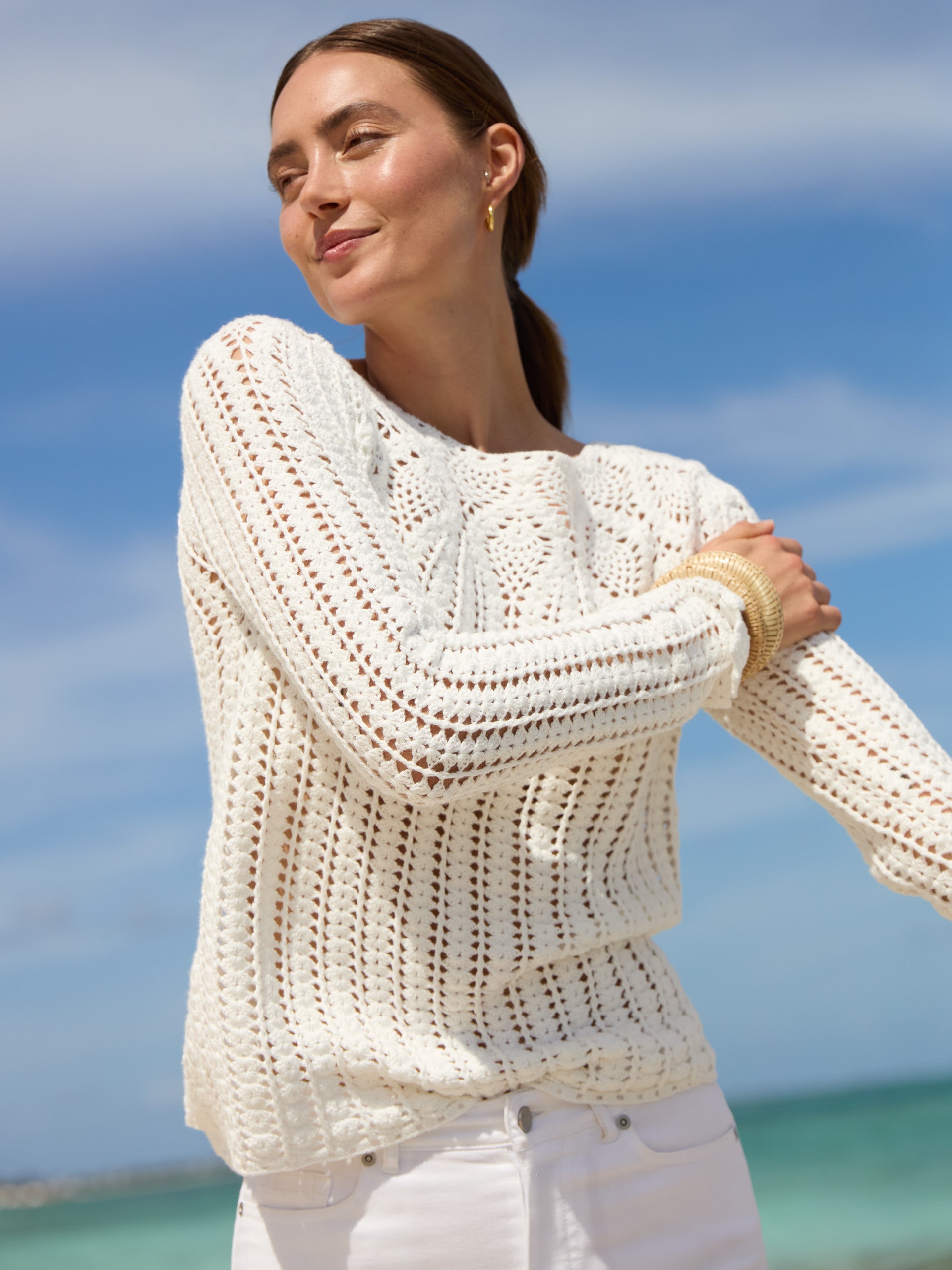 J.McLaughlin model wears Shellona Crochet Sweater in white made with cotton.