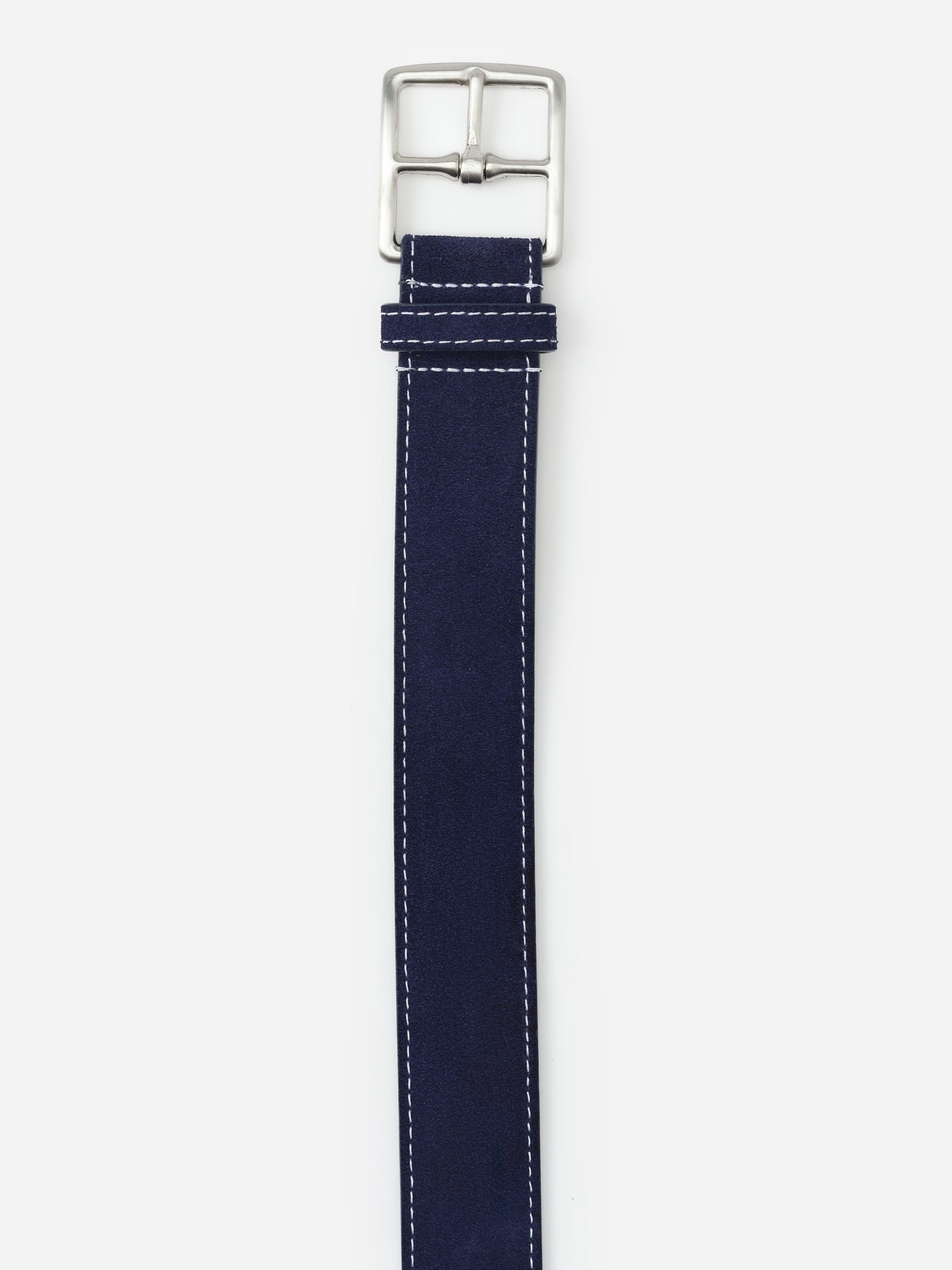 Navy suede belt with silver buckle and white stitching by J. McLaughlin, showcasing effortlessly stylish, enduring designs and innovative fabrics for a legacy of timeless fashion. A destination for defining style. Life, Well-Lived.