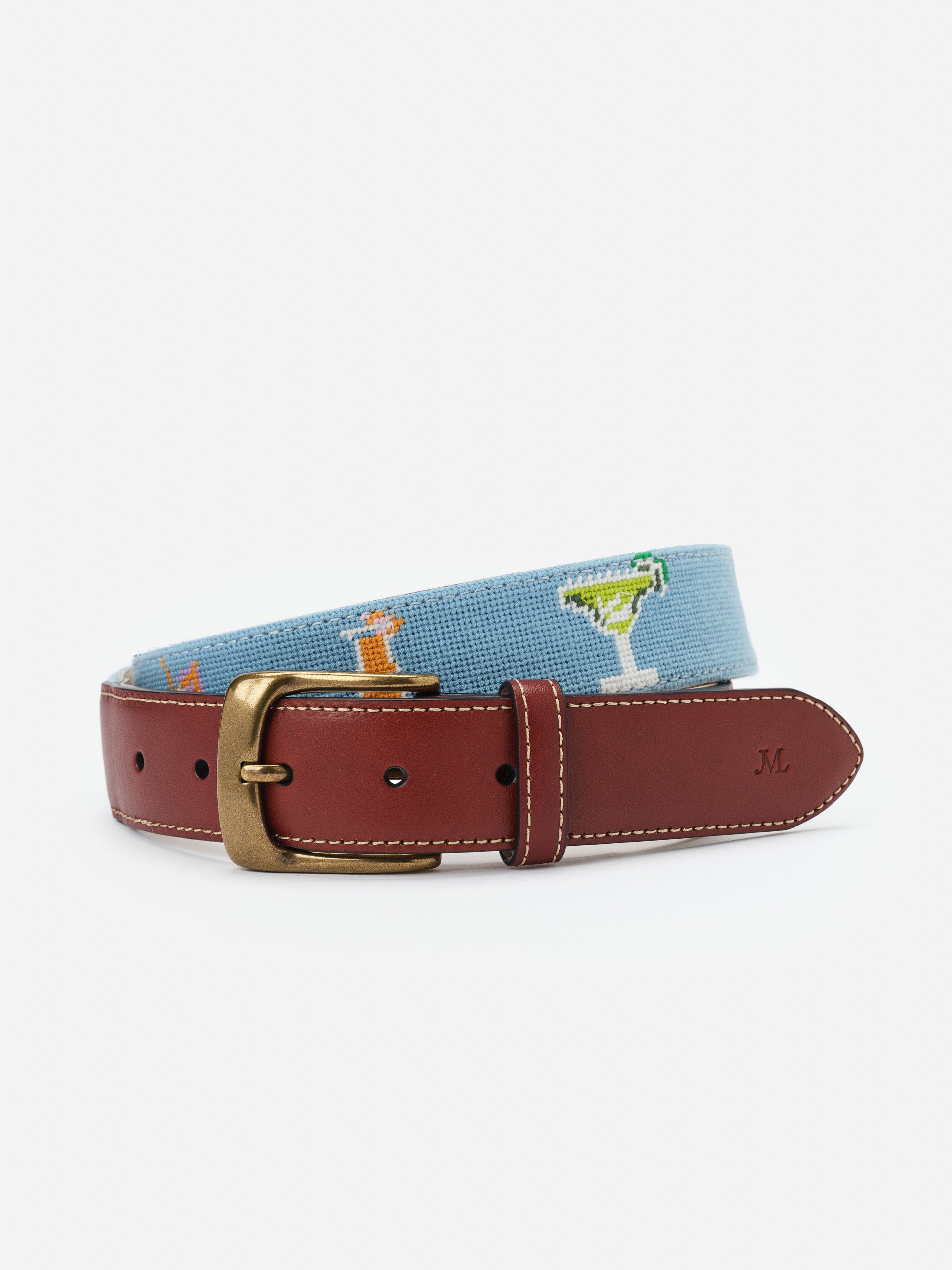 Needlepoint Belt in Cocktail Party by J.McLaughlin features a classic leather buckle and playful cocktail-themed needlepoint design, showcasing effortlessly stylish, enduring designs and a legacy of timeless fashion. A destination for defining style. Life, Well-Lived.