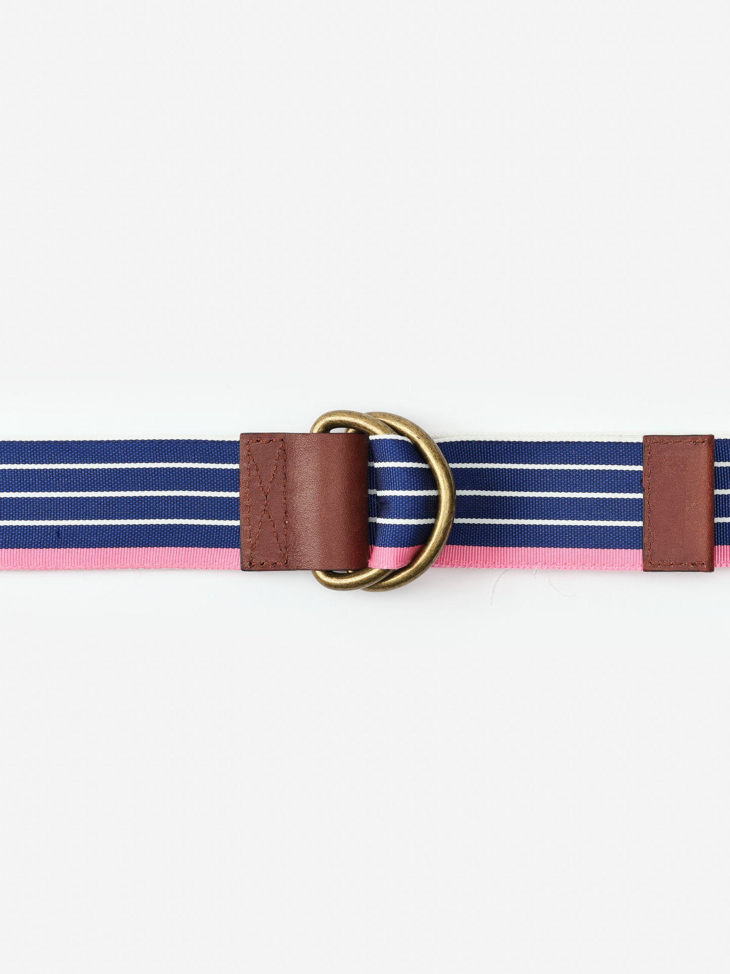 Ribbon Belt in Stripe by J.McLaughlin features enduring designs with navy and pink stripes, leather accents, and brass rings, reflecting a legacy of timeless fashion and effortless style.