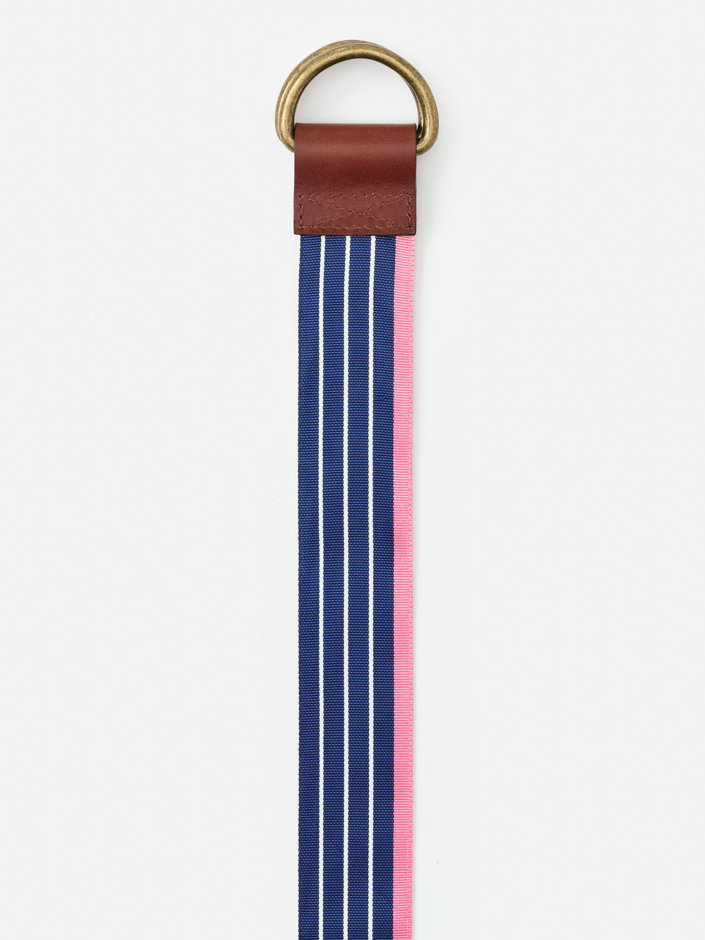Ribbon Belt in Stripe by J.McLaughlin features a navy and pink striped fabric with leather and brass accents, showcasing effortlessly stylish, enduring designs for a life well-lived.