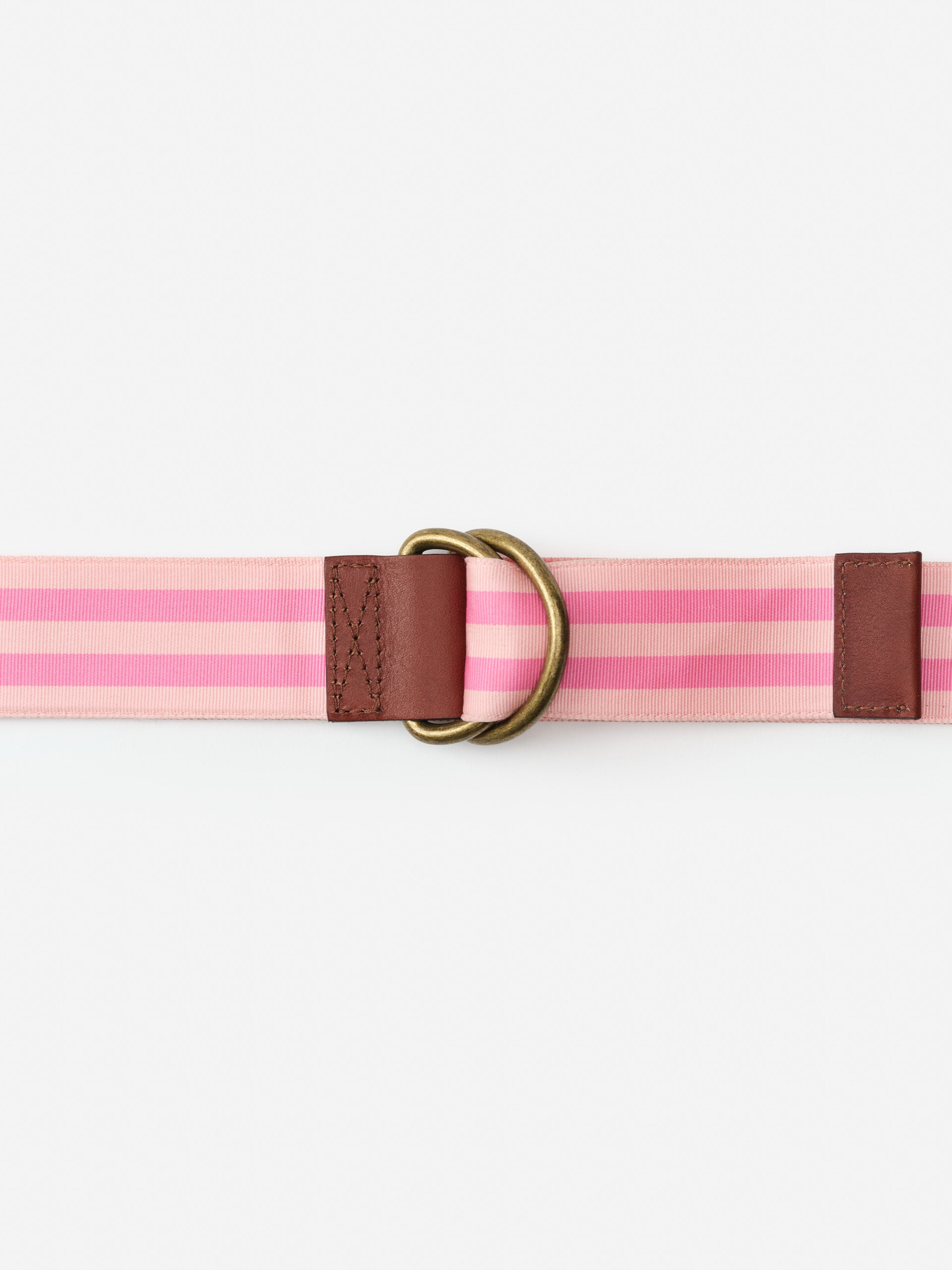 Ribbon Belt in Stripe featuring pink stripes and brown leather accents with brass hardware, embodying J.McLaughlin’s effortlessly stylish, enduring designs for a life well-lived.