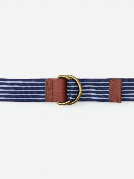 Ribbon Belt in Stripe by J.McLaughlin featuring navy and light blue stripes, brown leather accents, and brass hardware, showcasing effortlessly stylish, enduring designs.