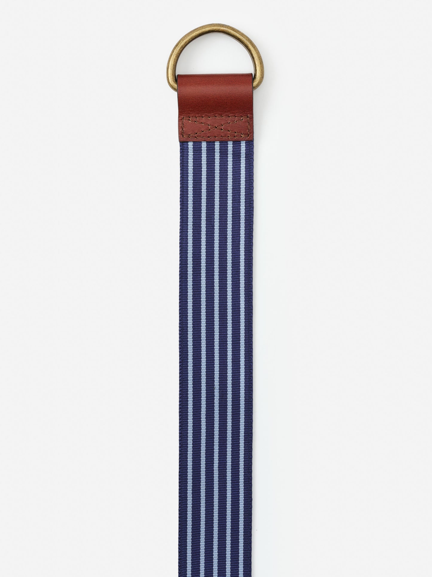 Ribbon Belt in Stripe by J.McLaughlin featuring classic navy and light blue stripes with a leather accent and brass ring, showcasing effortlessly stylish, enduring designs.
