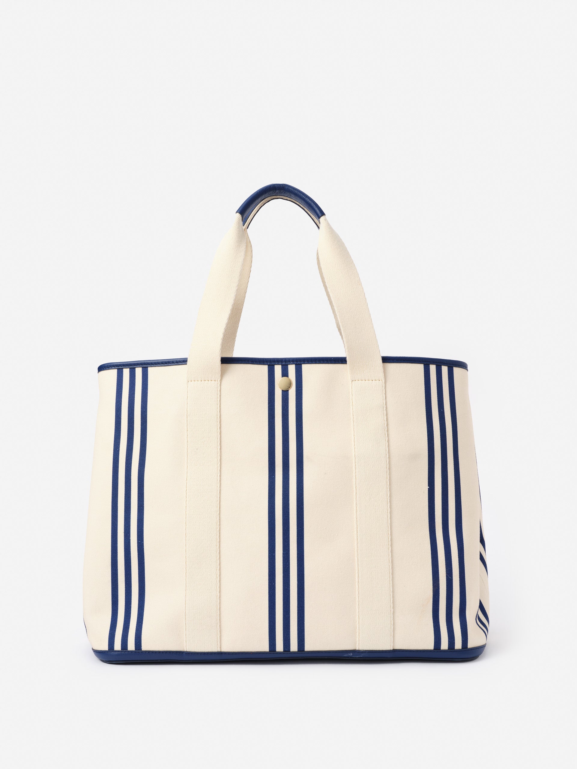 Alma Canvas Tote in Stripe by J.McLaughlin features classic navy stripes on durable canvas, combining effortlessly stylish design with enduring quality for a legacy of timeless fashion.