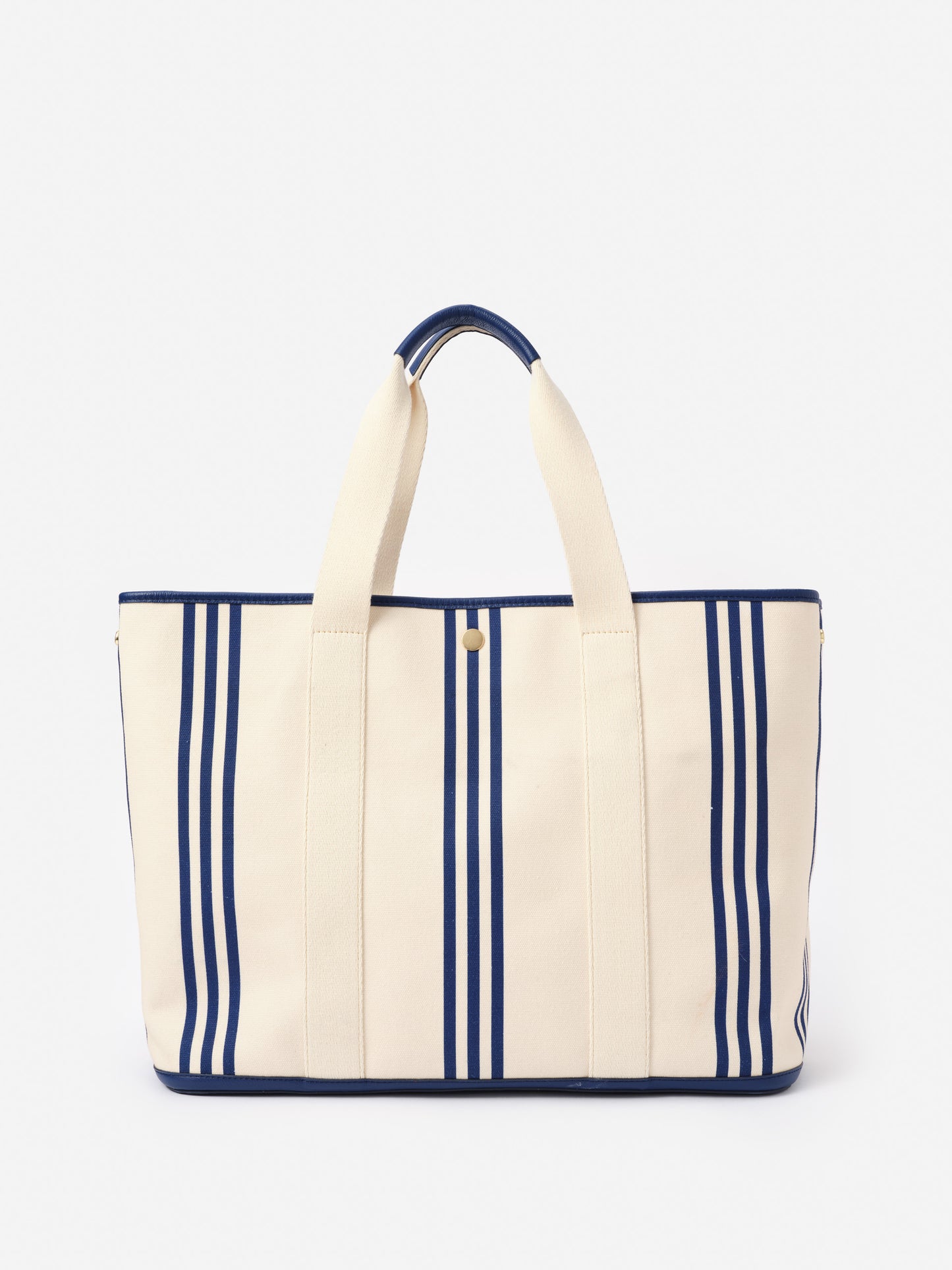 Alma Canvas Tote in Stripe by J.McLaughlin features a navy and cream striped design with sturdy handles, combining effortlessly stylish looks with enduring designs made from innovative fabrics. A destination for defining style. Life, Well-Lived.