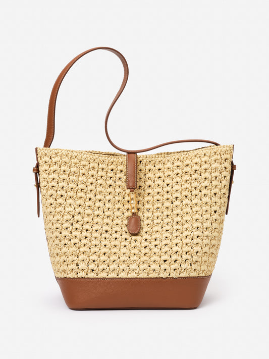 Crawford Raffia Handbag by J.McLaughlin features a woven raffia body with smooth leather accents, blending effortless style with enduring designs for a timeless look.