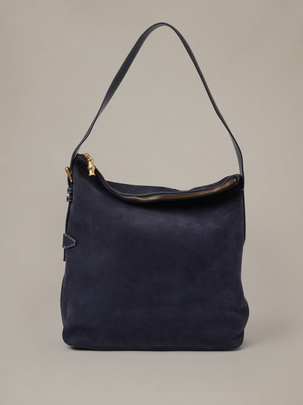 The Montecito Suede Hobo Bag by J.McLaughlin in deep navy suede with a slouchy silhouette shoulder strap and zip top