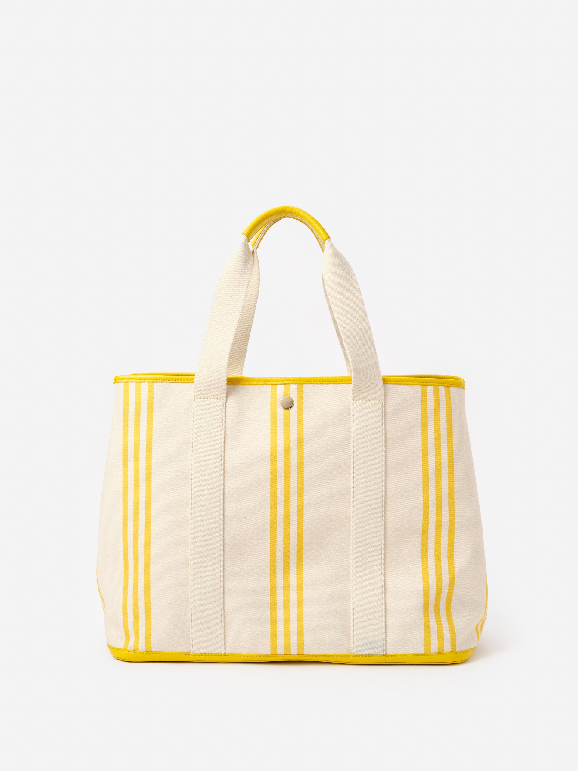 Alma Canvas Tote in Stripe by J.McLaughlin features effortlessly stylish yellow and cream stripes, crafted with innovative fabrics and enduring designs for a life well-lived.